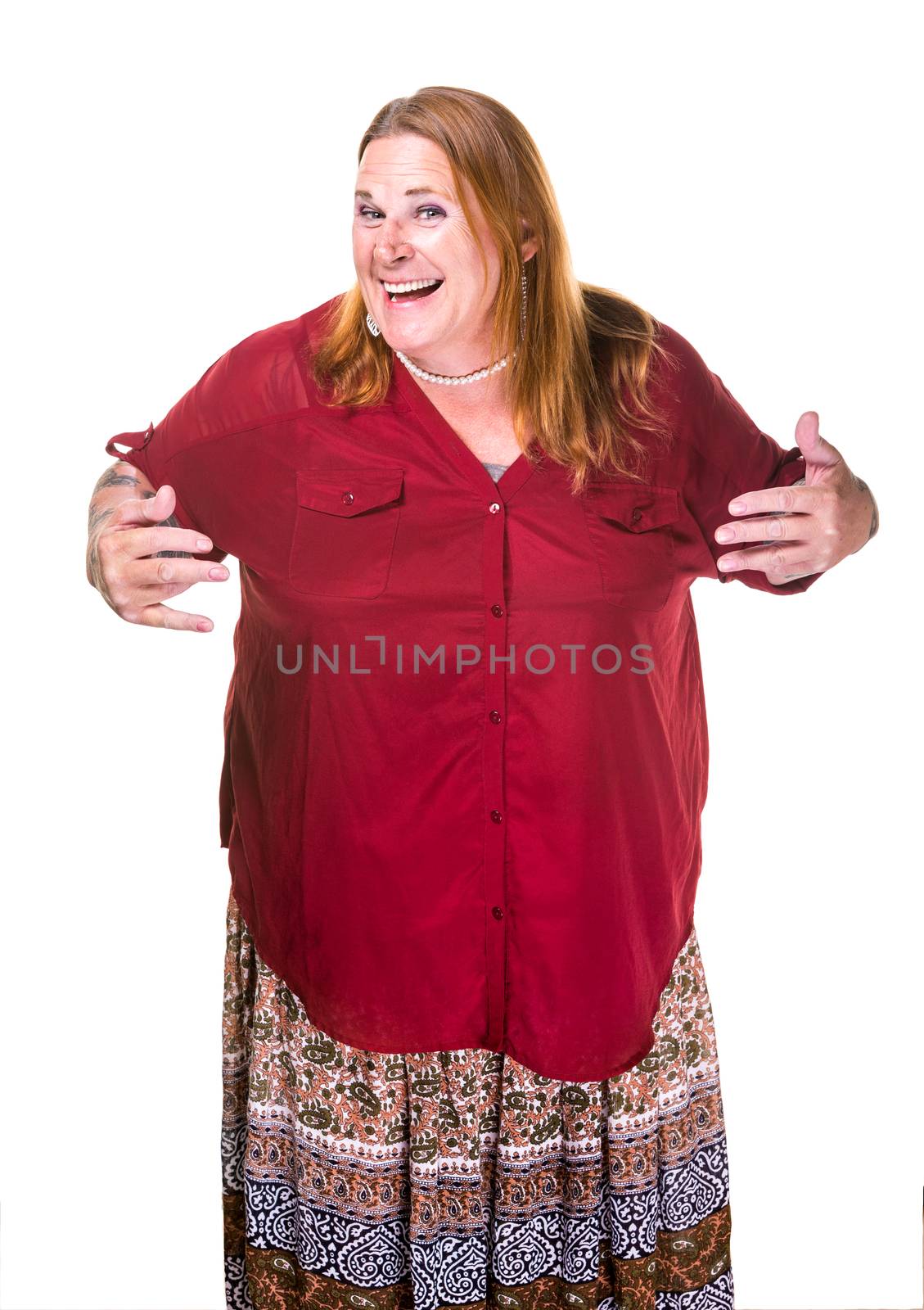 Transgender woman in pearl necklace and red dress