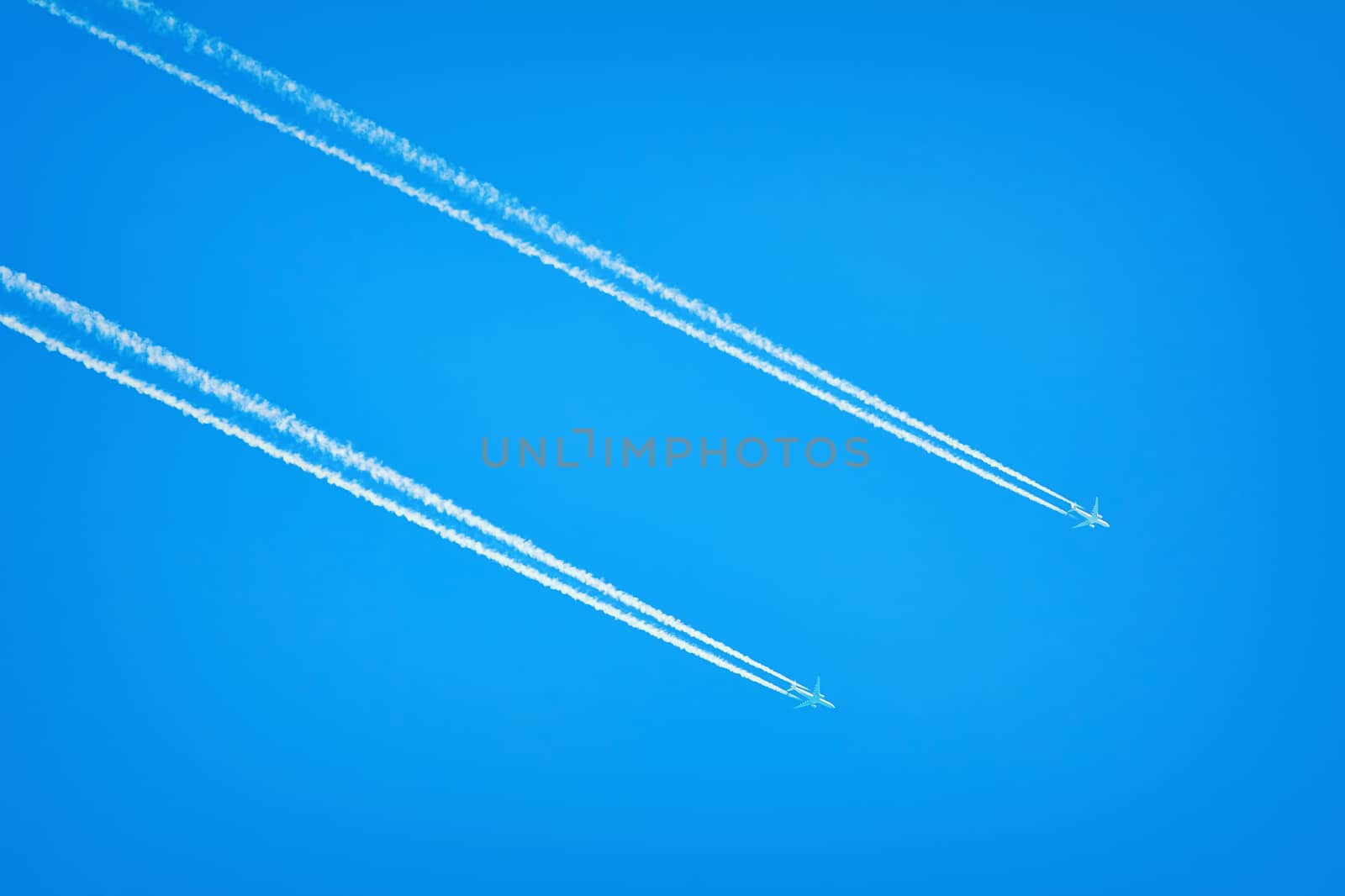 Two Jet Airplanes in the Blue Sky