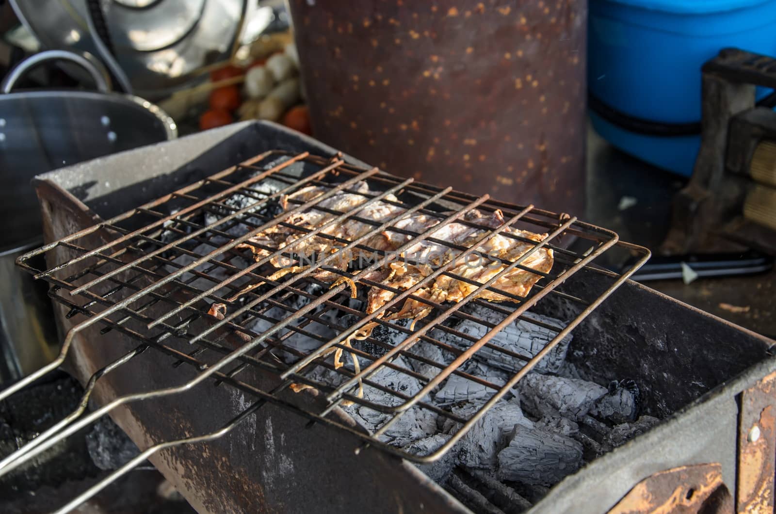 Dried squid, grilled on charcoal in Thailand by worrayuth