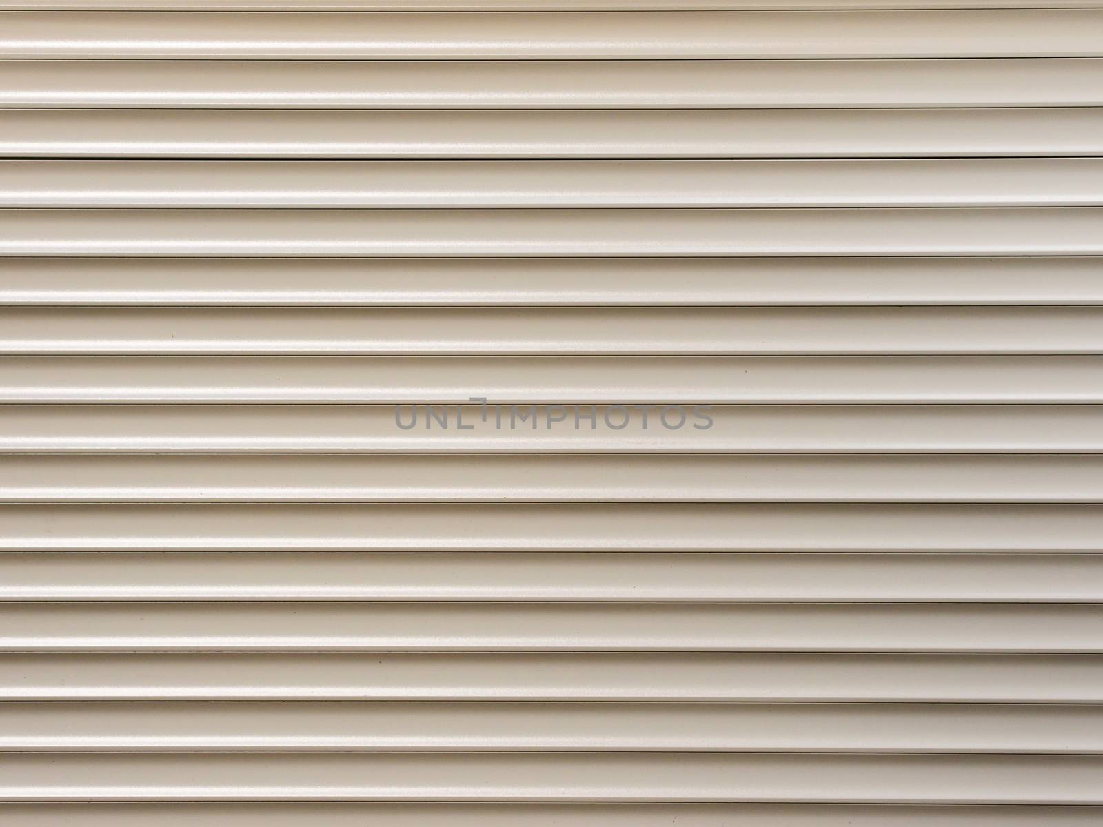 white metal roller shutter from shop door