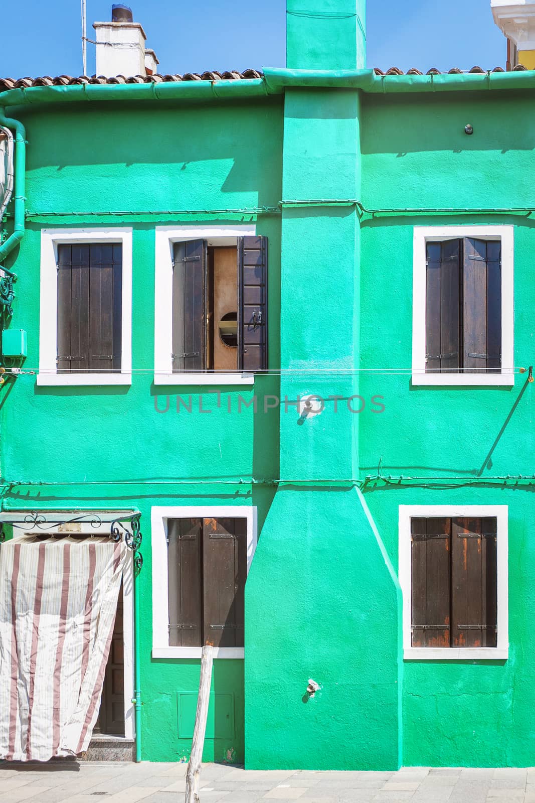 Colorful beautiful green house in Venice, Italy
