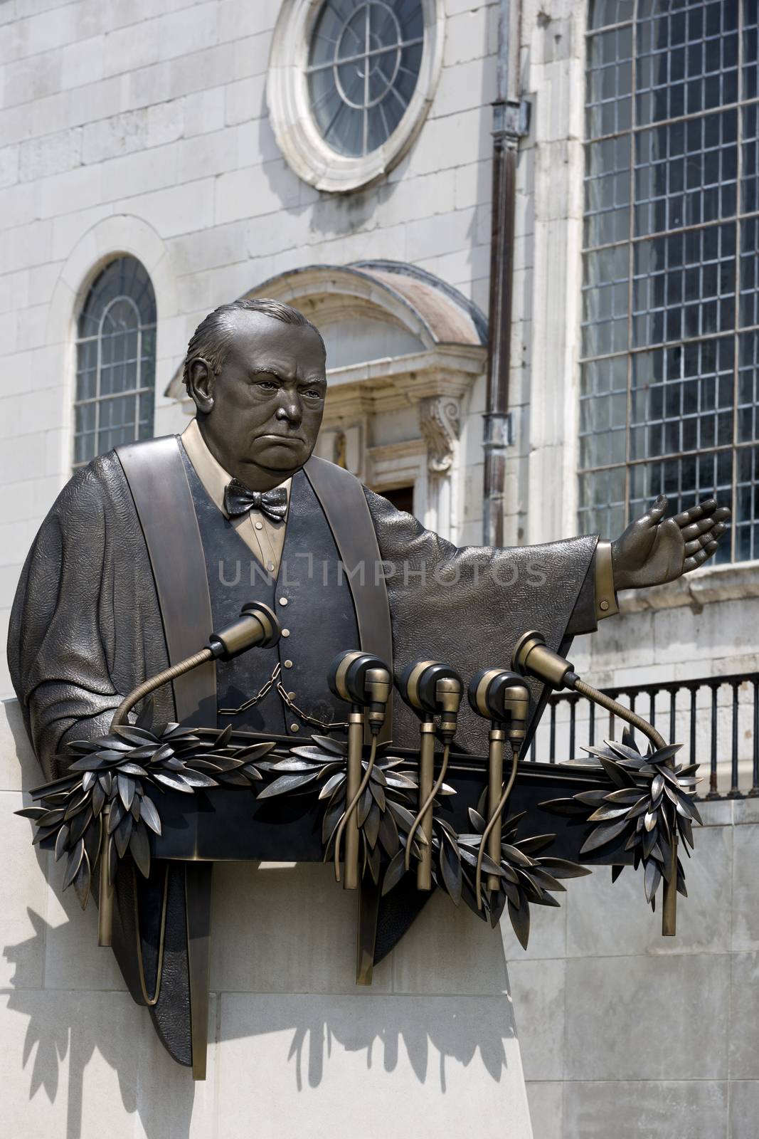 FULTON, MISSOURI – July 1, 2015: Don Wiegand’s bronze sculpture commemorates Winston Churchill's"Iron Curtain" speech.  Location is outside National Churchill Museum, on the campus of Westminster College, Fulton, Missouri