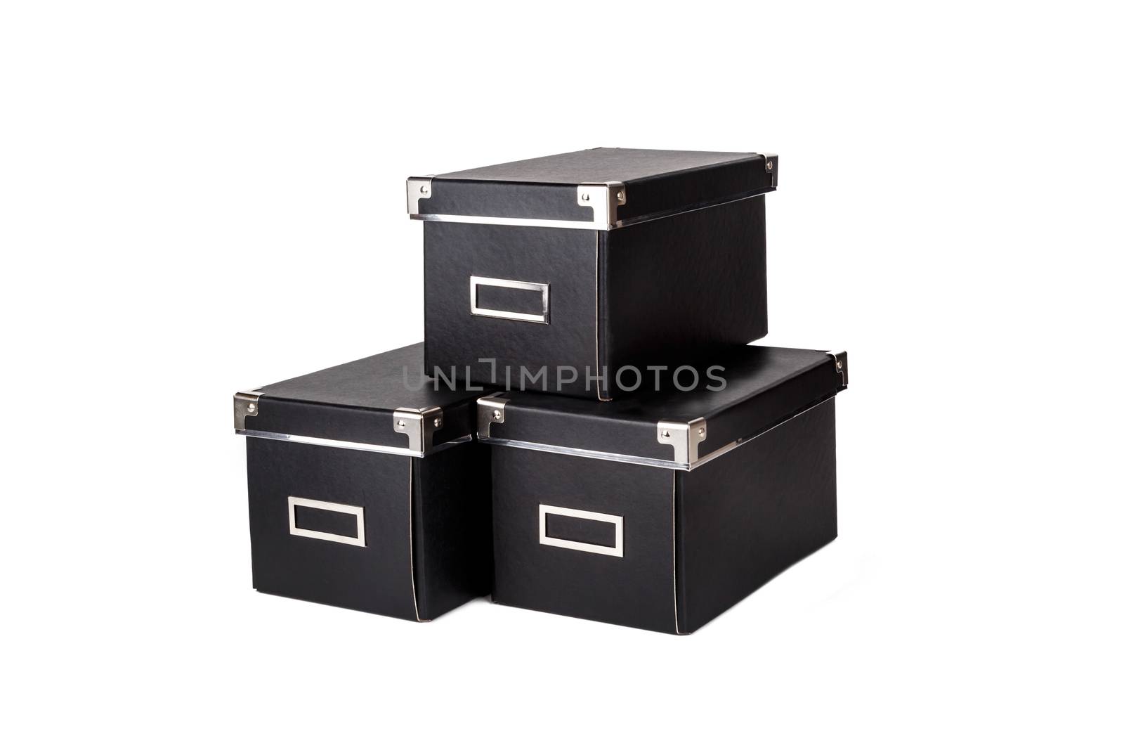 Close up view of three black cardboard box isolated on white background.