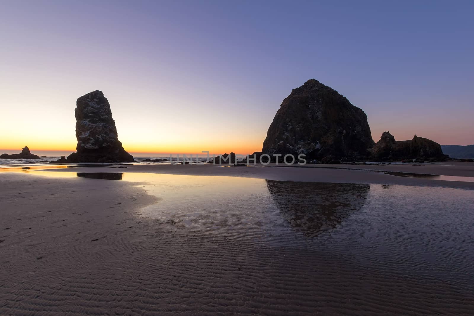 Haystack Rock and the Needle at Cannon Beach along Oregon Coast at sunset