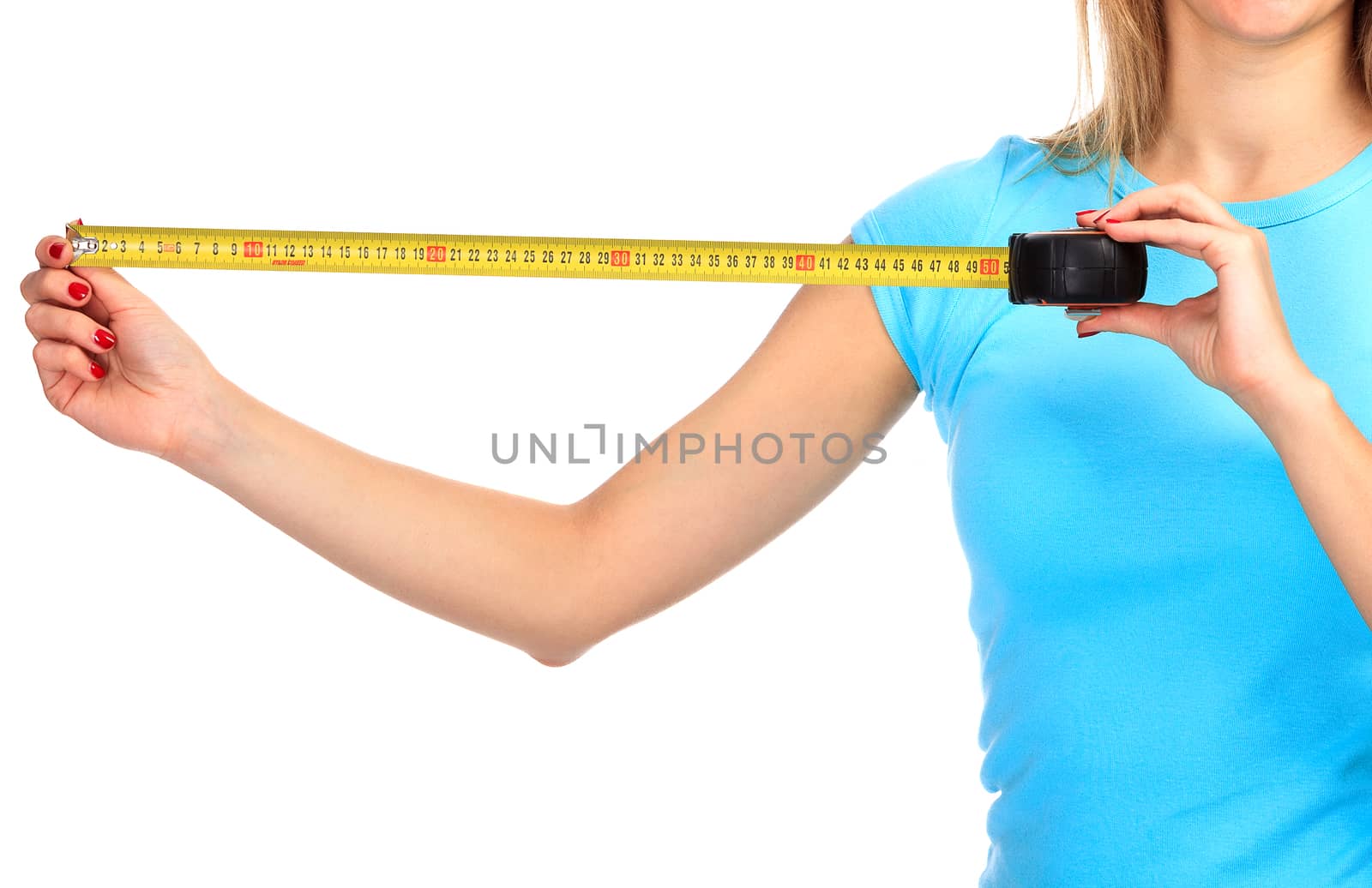 Woman shows a yellow measure tape, isolated on a white background