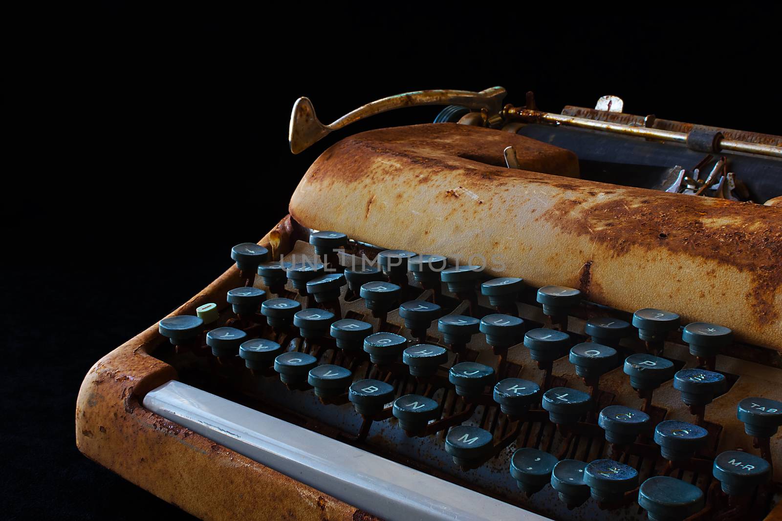 Typewriter, Waiting for Inspiration. Vintage Rusty Typewriter Machine. Journalist Equipment. Typewriter Close Up Isolated on Black Background.