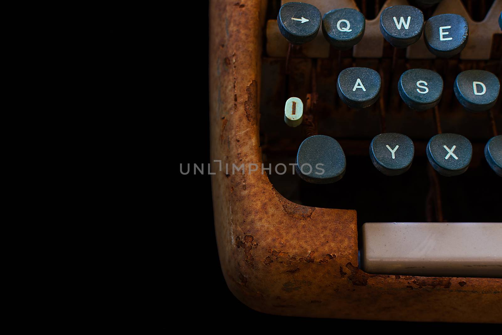 Typewriter, Waiting for Inspiration. Vintage Rusty Typewriter Machine. Journalist Equipment. Typewriter Close Up Isolated on Black Background.