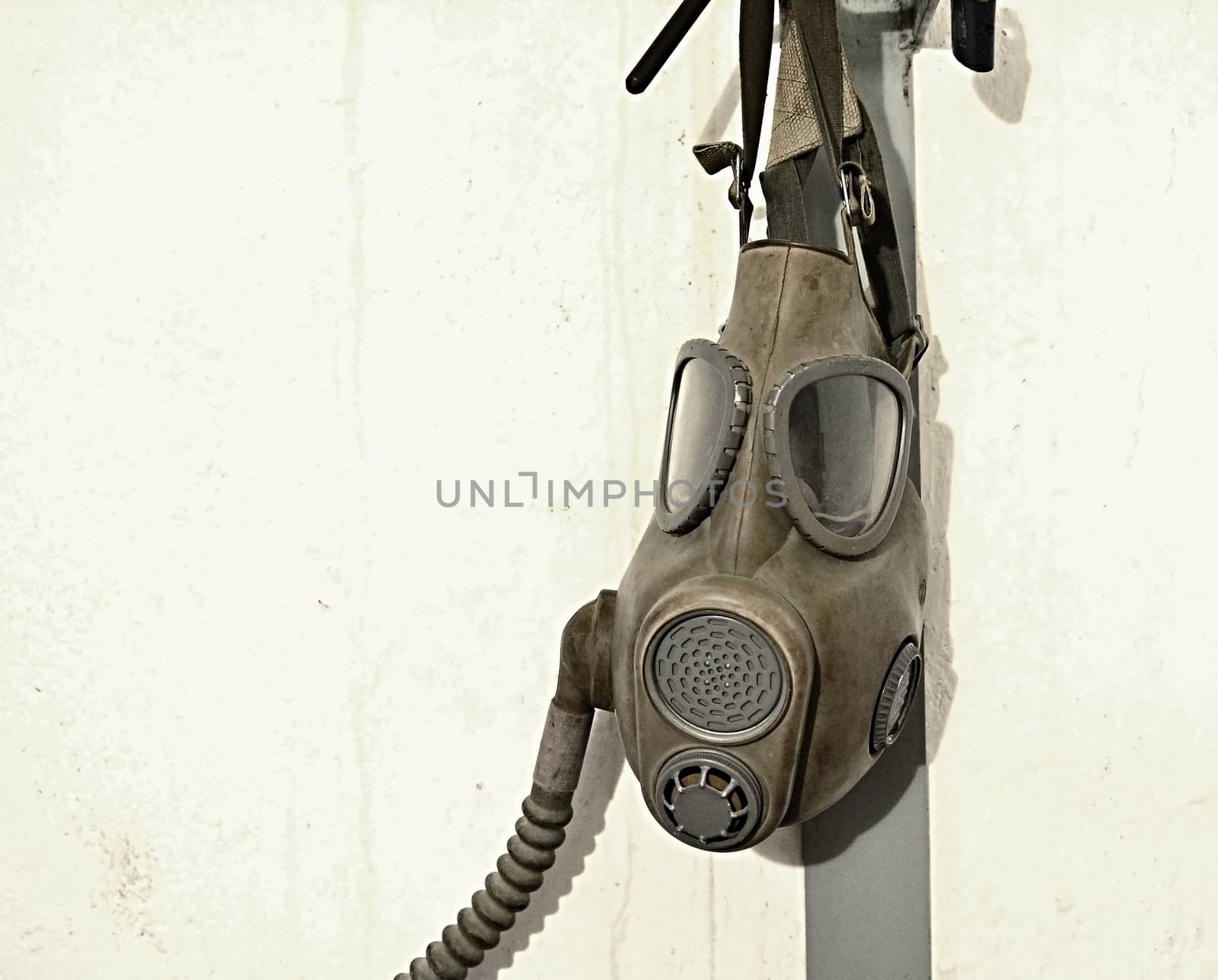 Old gas mask hanging on the wall.