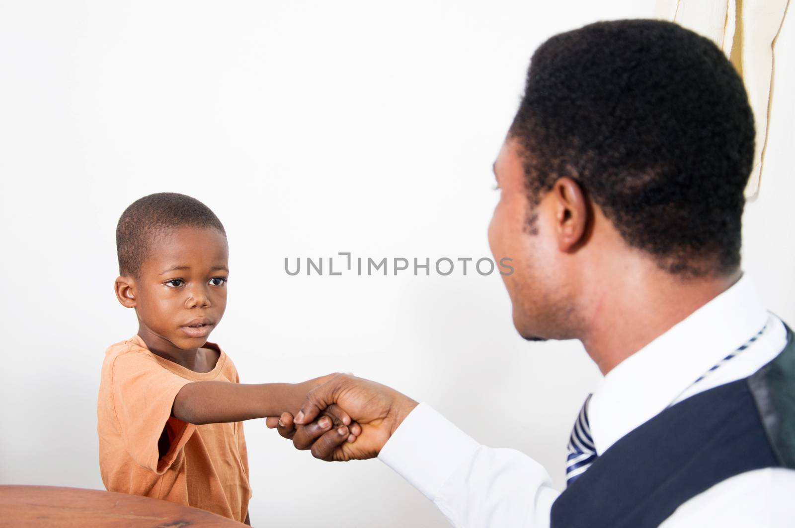 this  gentleman greets the little boy who seems to be afraid of him