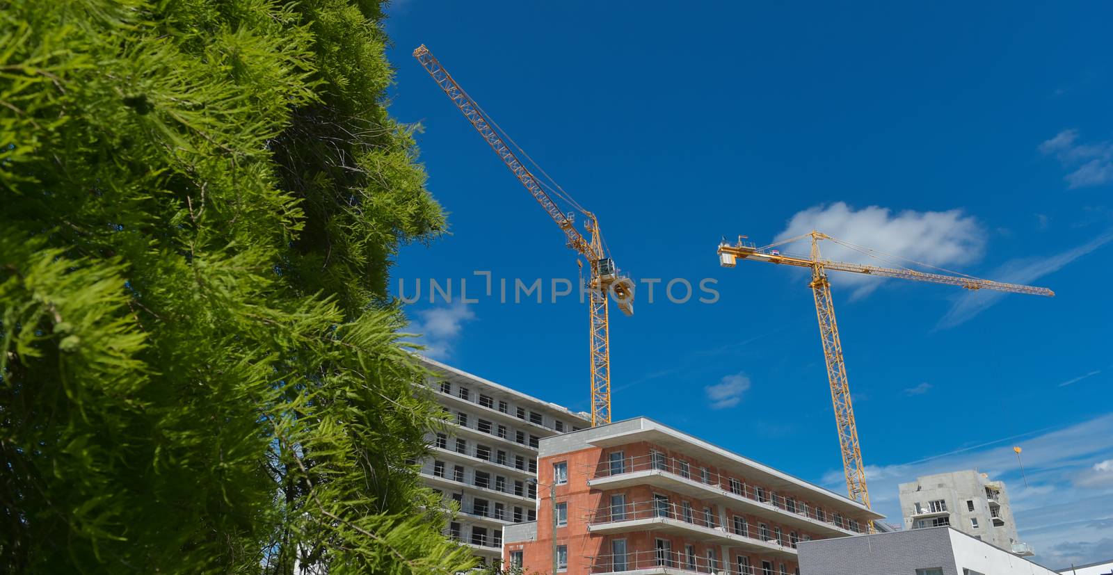 Building, House under construction and crane, France