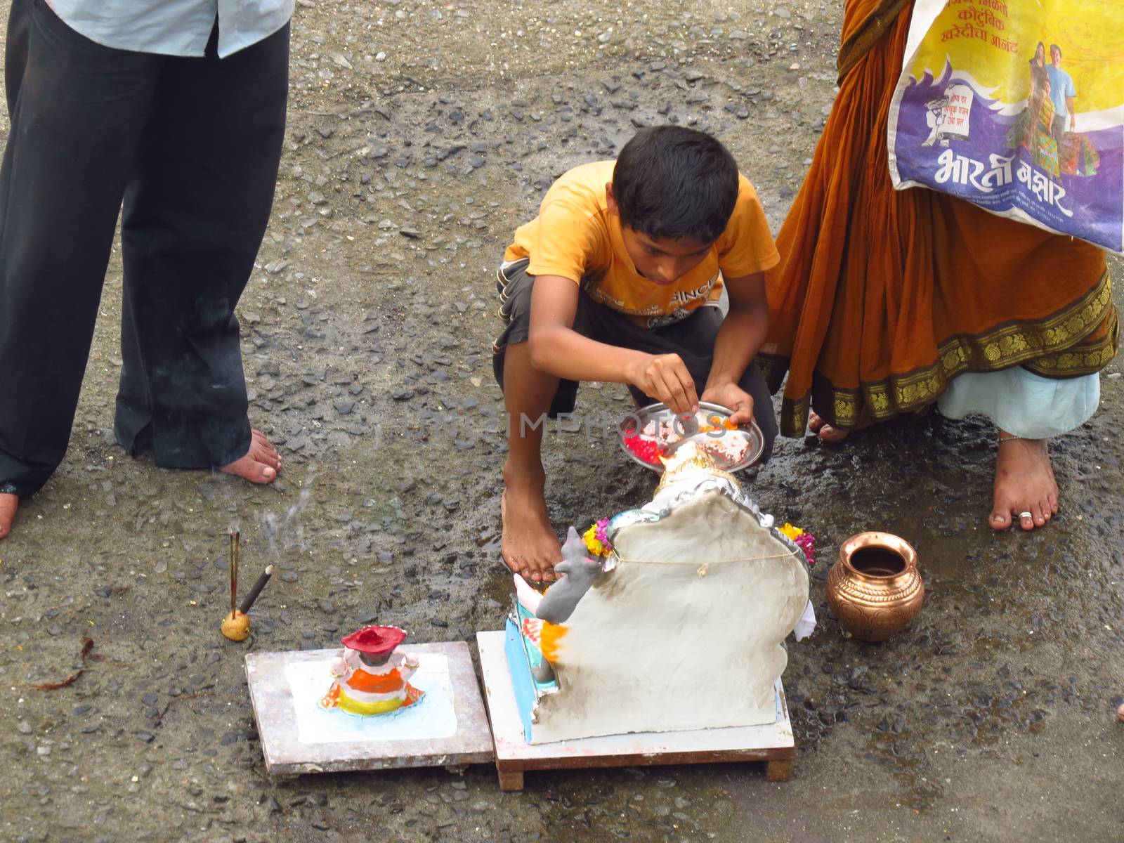 A young boy performs the traditional ritual of Lord Ganesh durin by thefinalmiracle