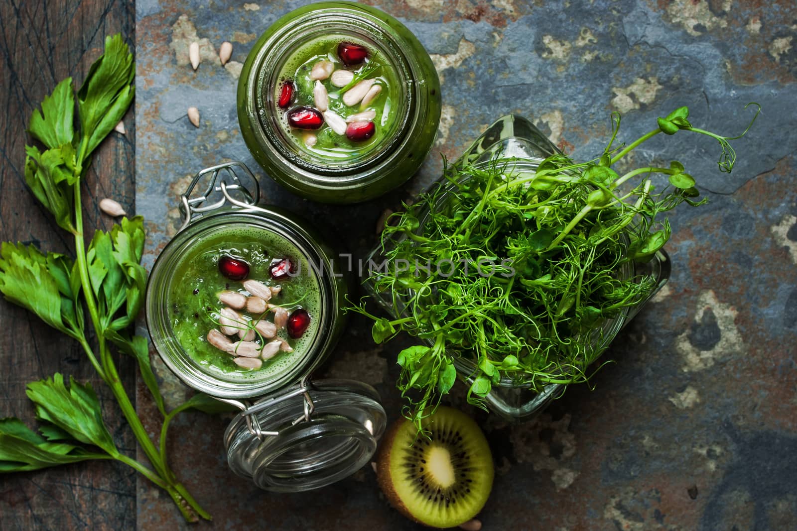 Vegan smoothie in a glass jars on the rustic table