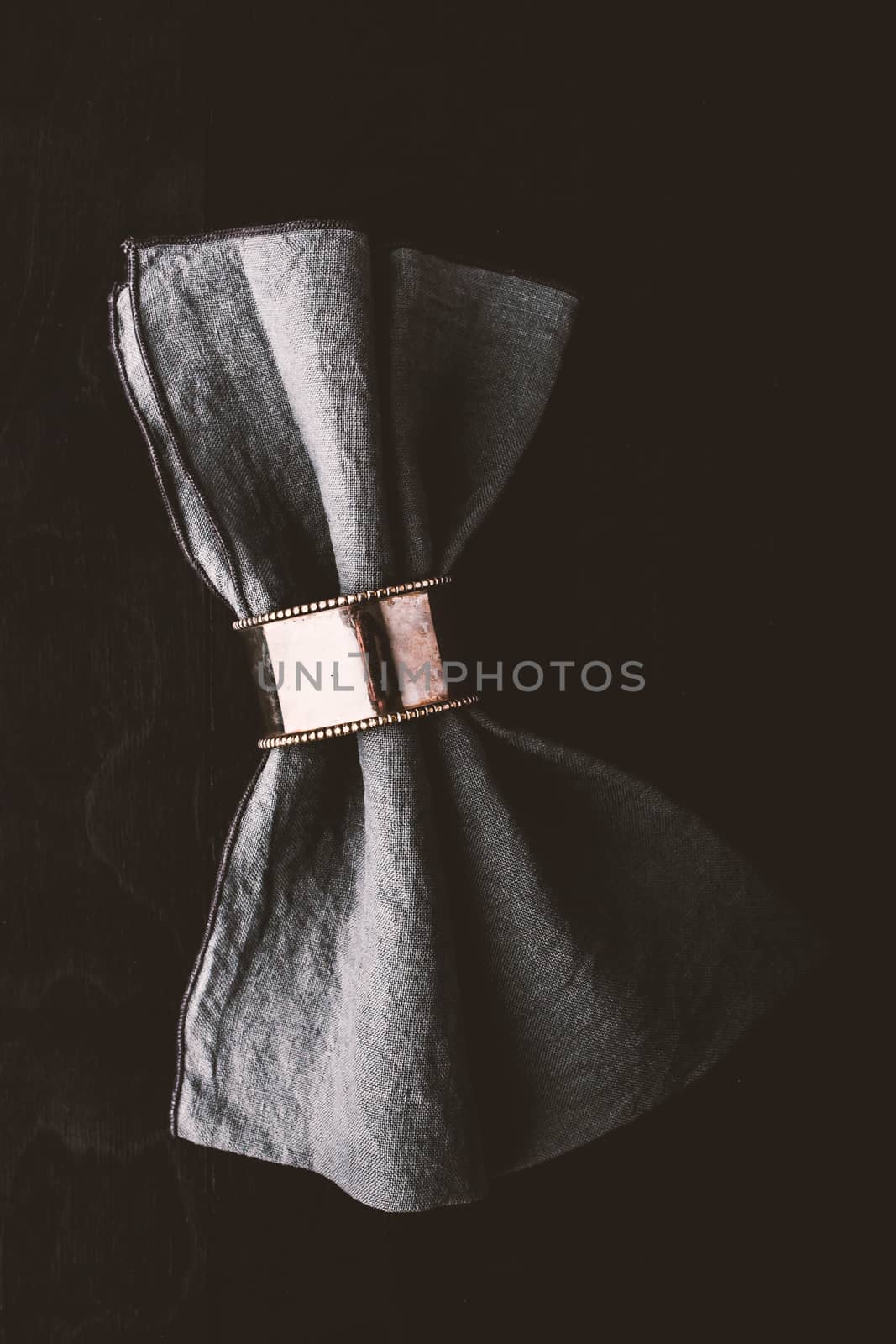 Grey napkin in the vintage metal ring by Deniskarpenkov