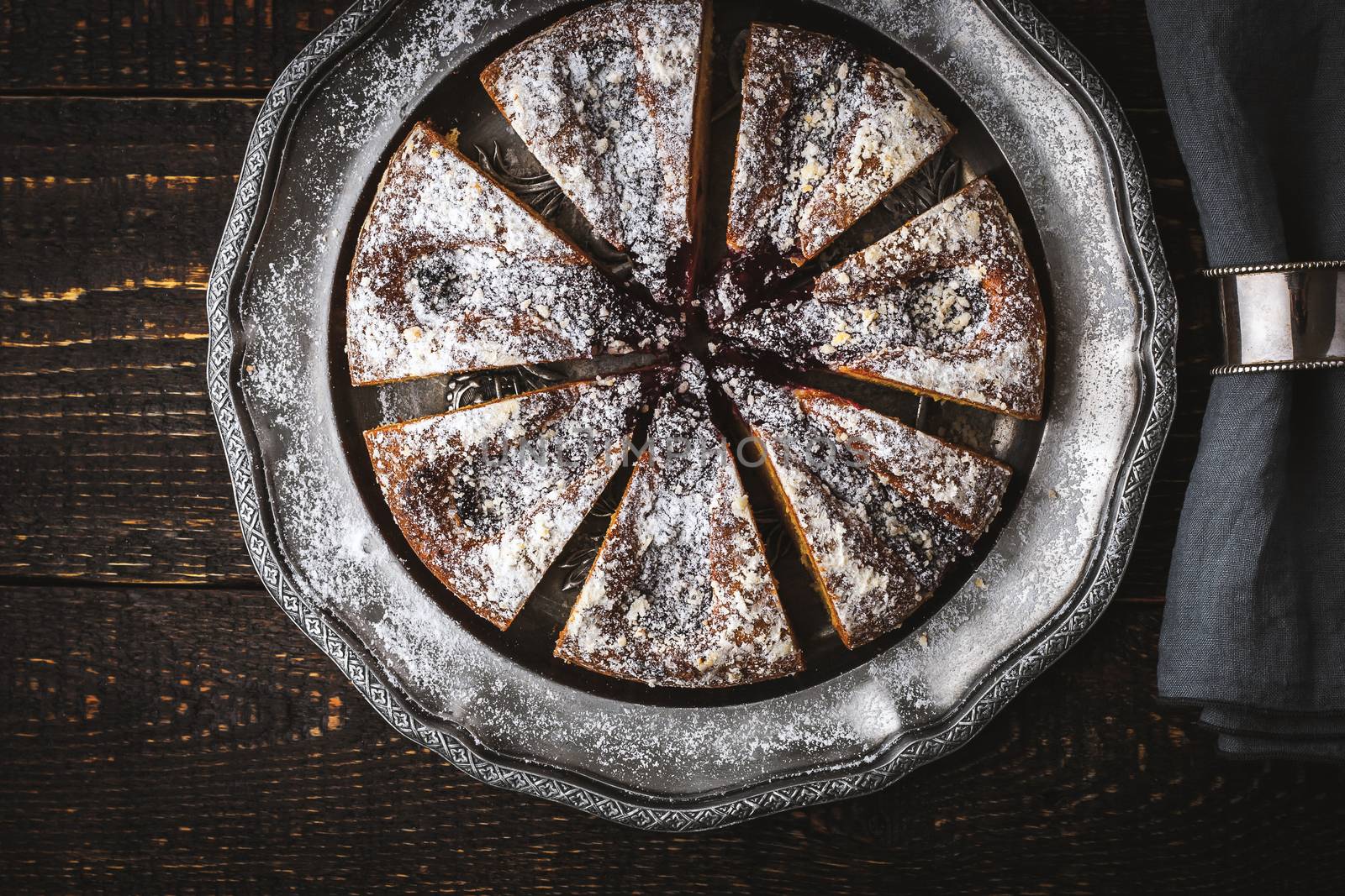 Sliced cake with icing sugar and jam by Deniskarpenkov