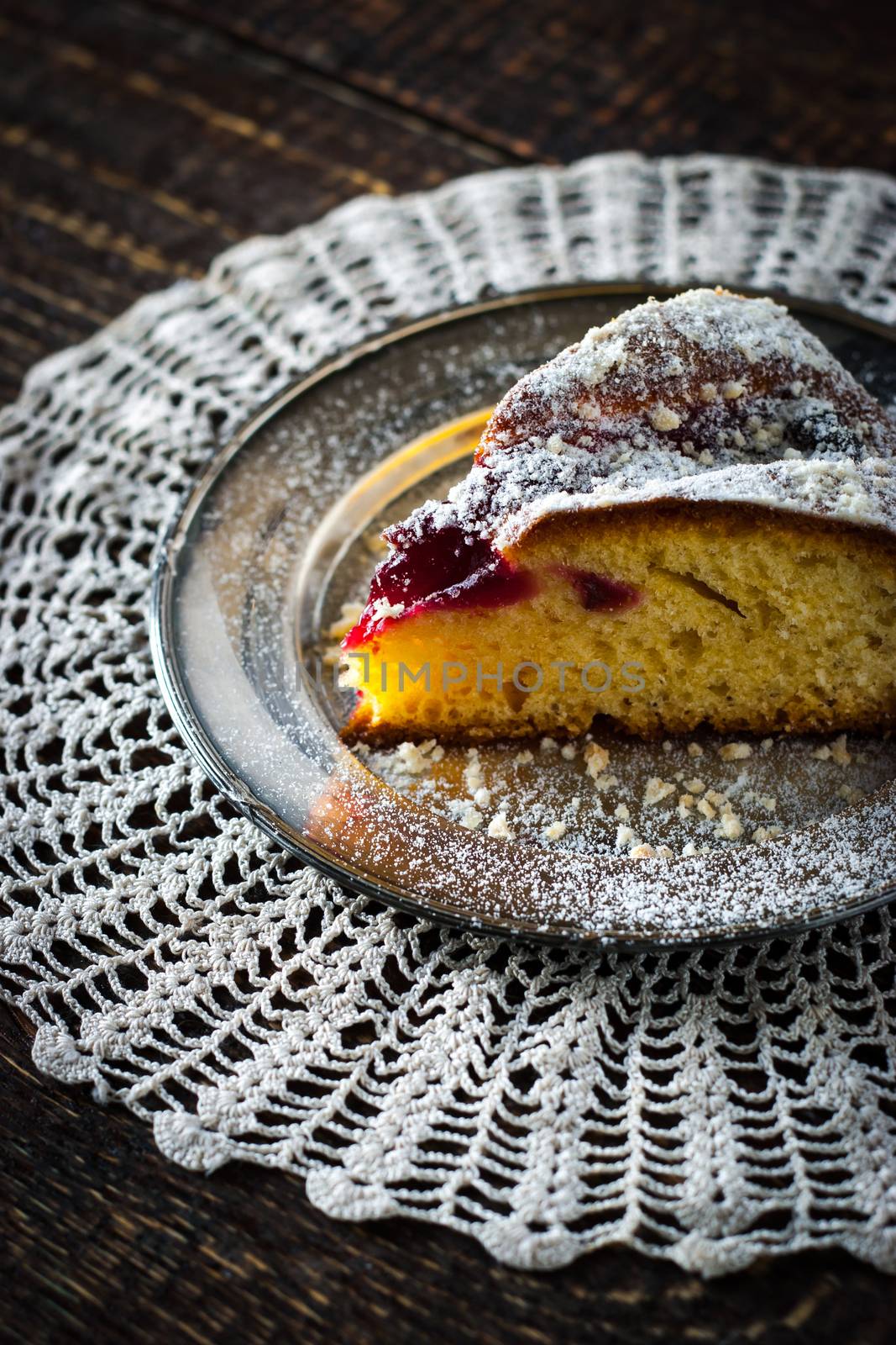 Sliced cake with icing sugar and jam by Deniskarpenkov