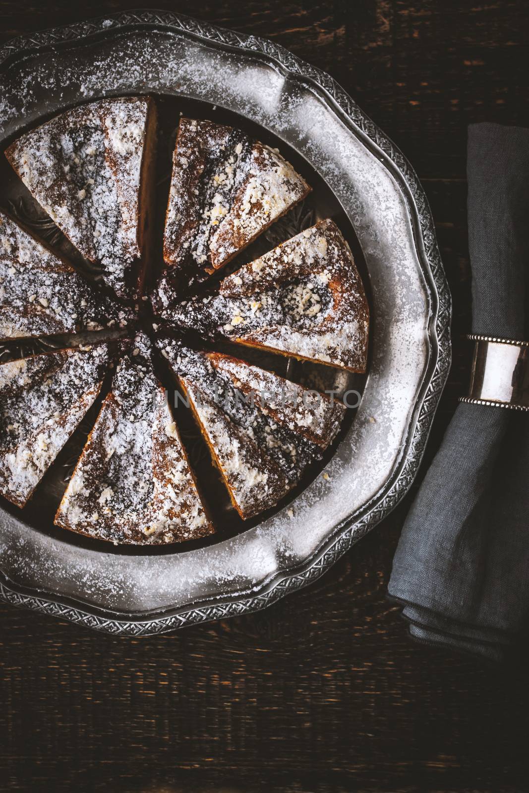 Sliced cake with powdered sugar by Deniskarpenkov