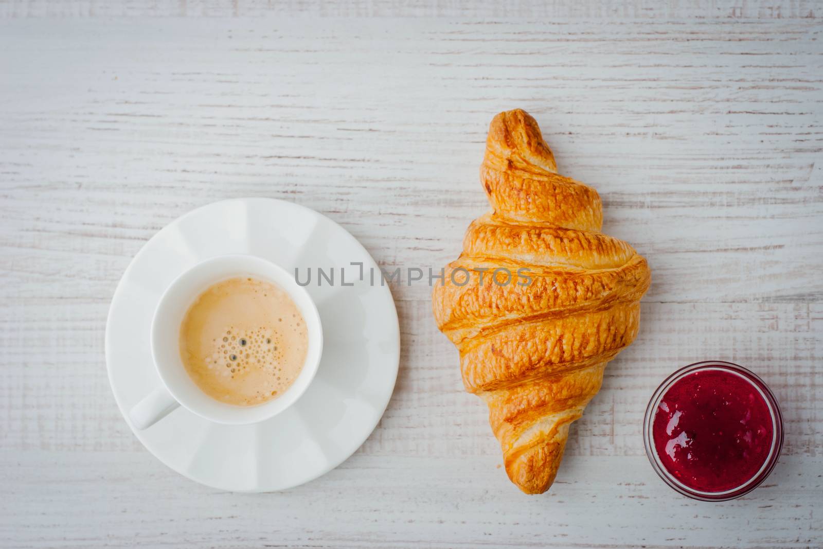 Cup of coffee with croissant and jam by Deniskarpenkov