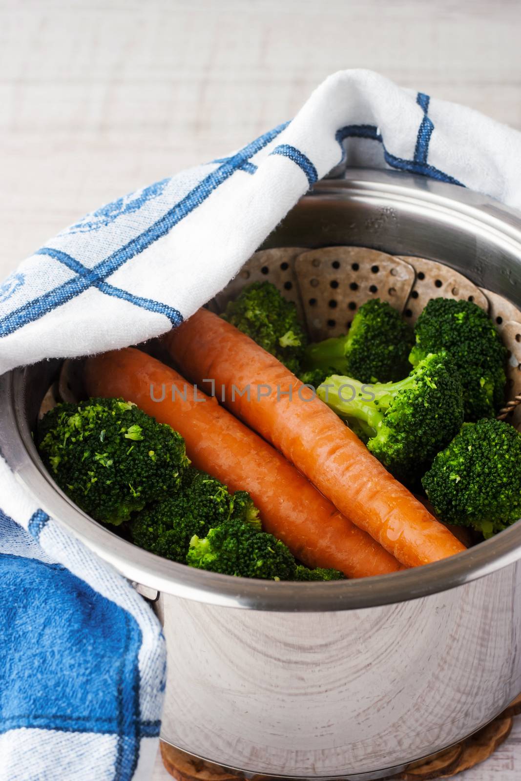 Carrots and broccoli in a steamer