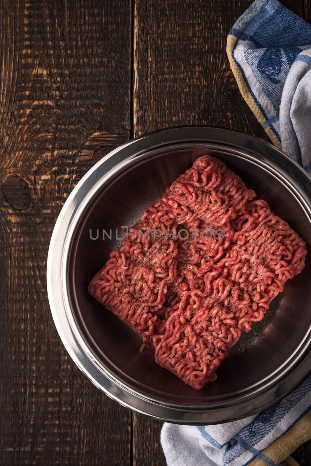 Ground beef with pepper in the metal pan vertical