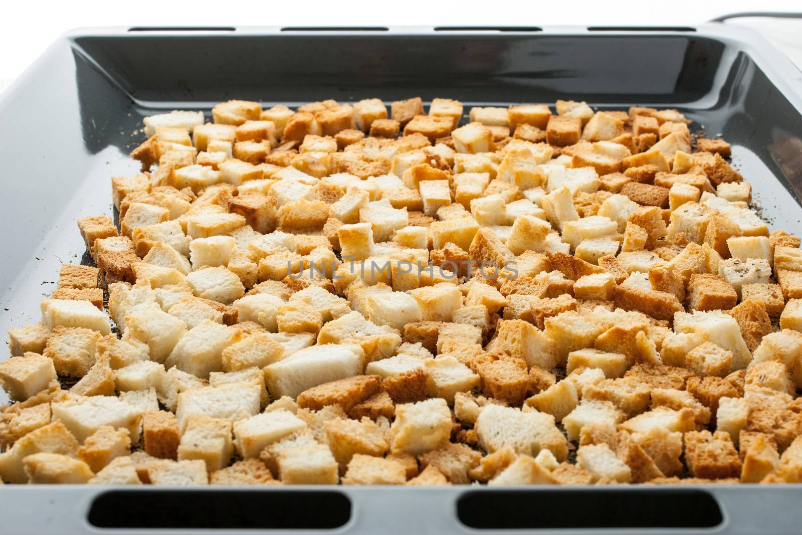 Small croutons on a baking tray horizontal