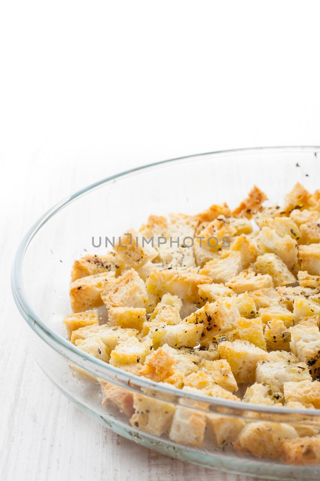 Small croutons with pepper  on the glass  dish at  the right of the table
