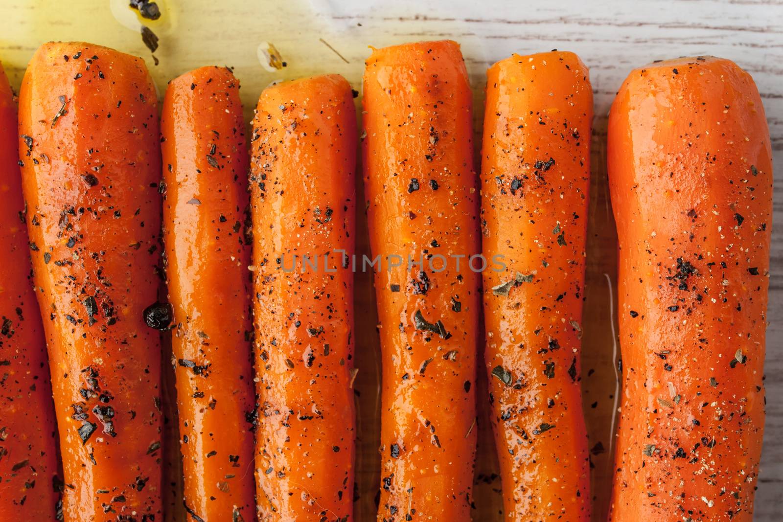 Baked carrots with herbs  close-up