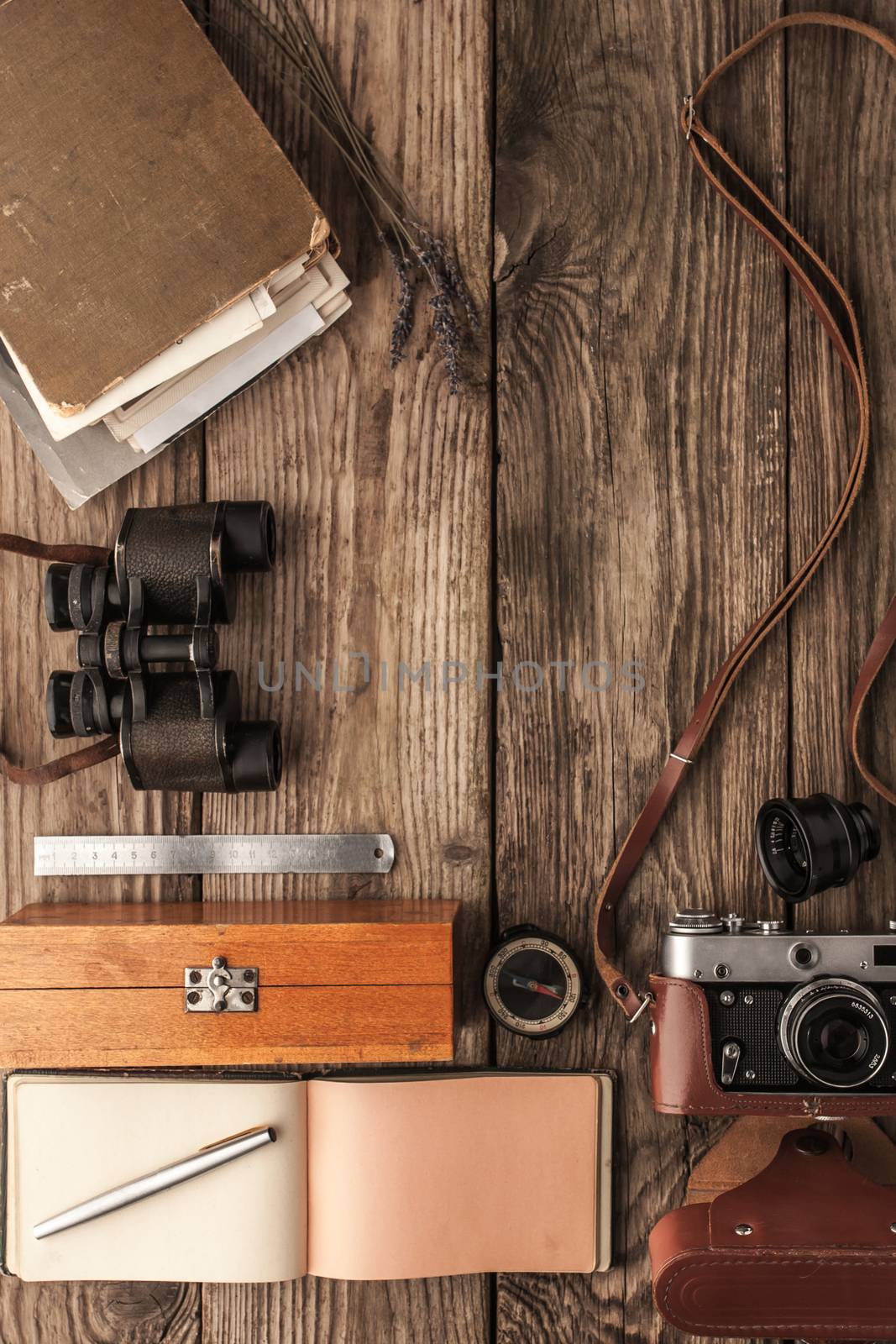 Traveler  things on the wooden background top view