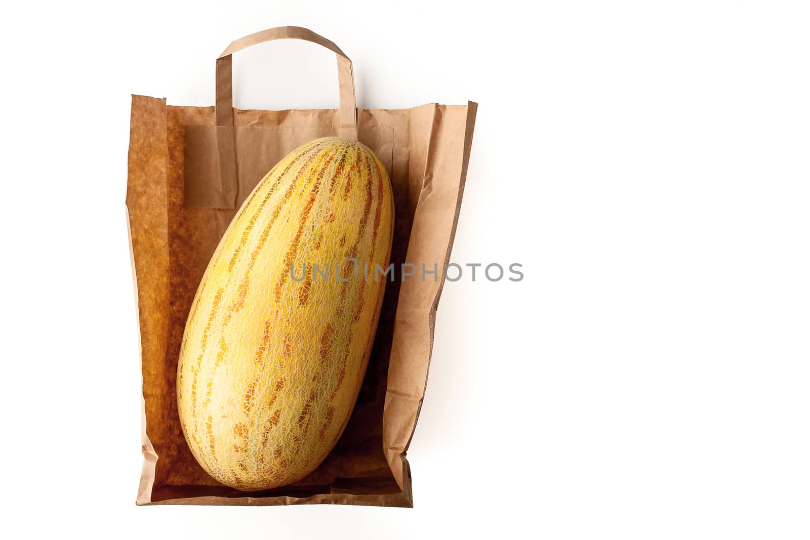Melon inside a paper bag