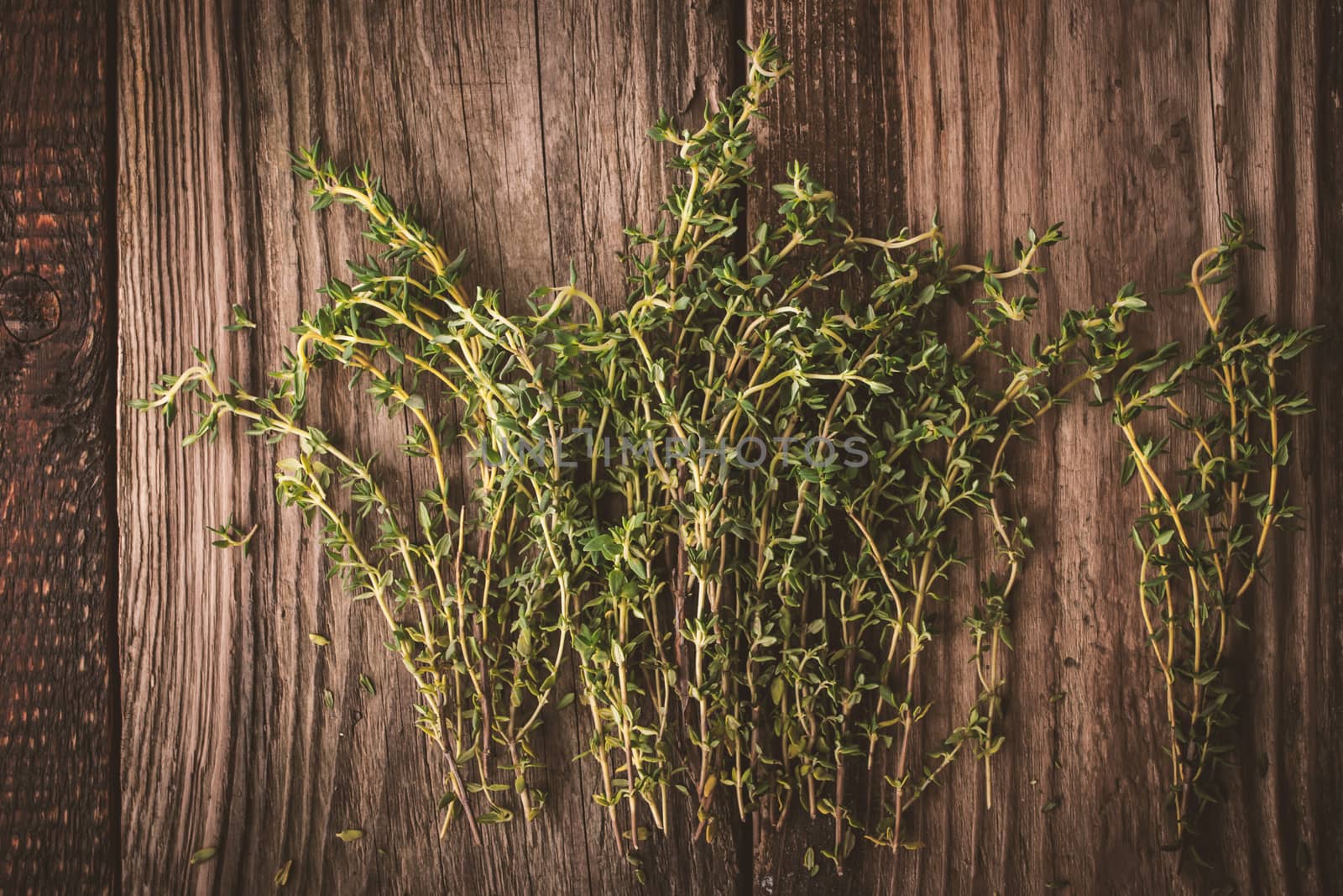 Thyme on the old wooden board horizontal