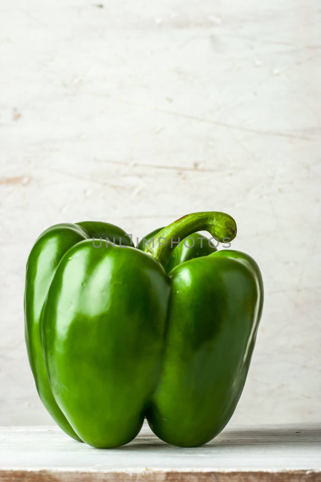 Sweet pepper on the white table vertical