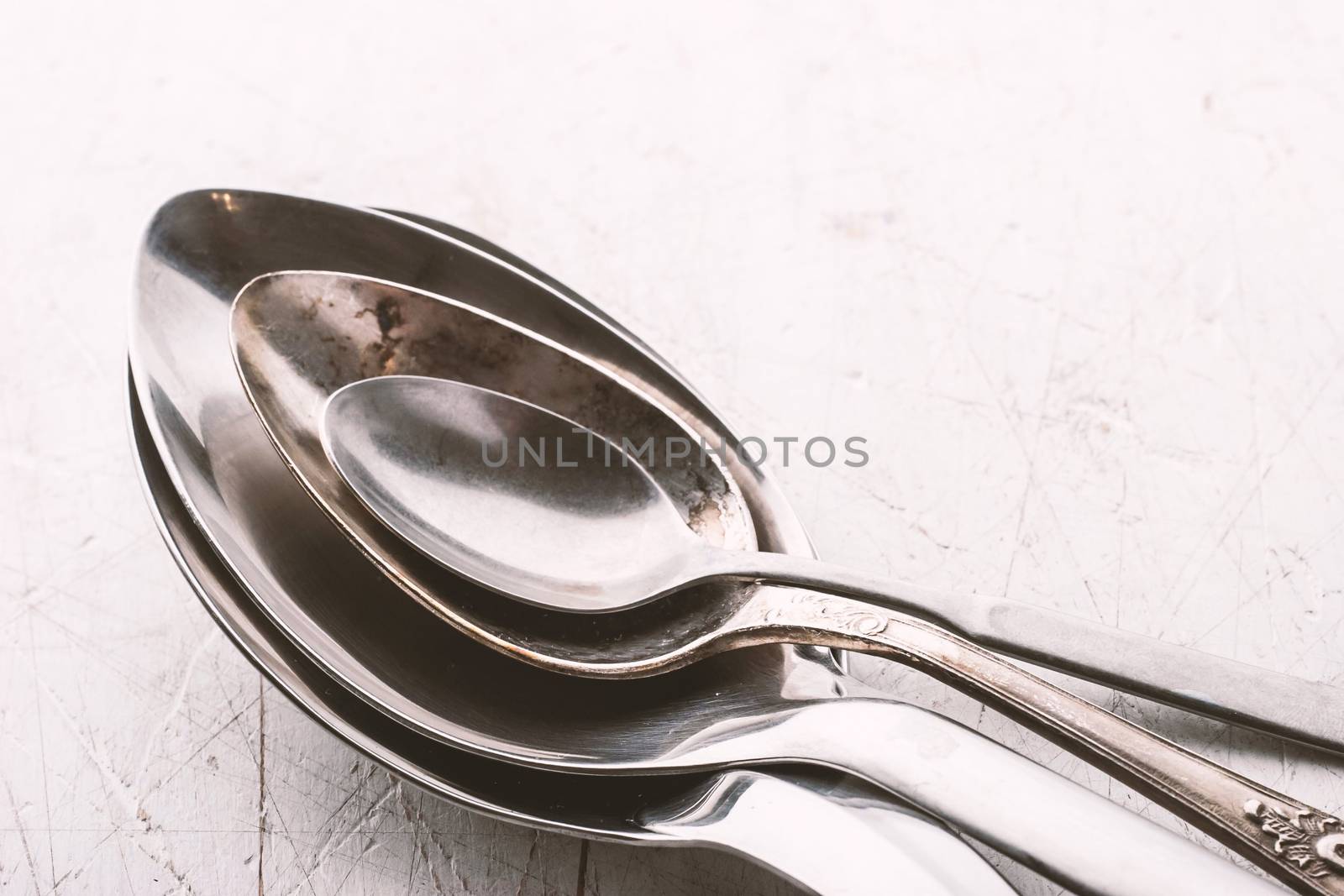 Set of metal spoon on the white table horizontal