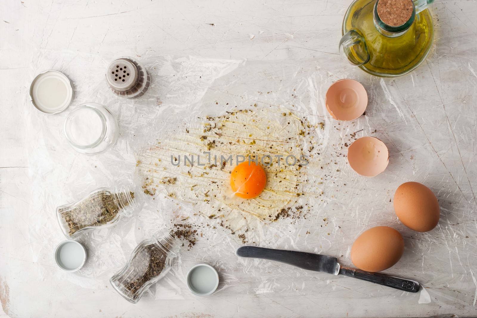 Broken egg with herbs mix by Deniskarpenkov