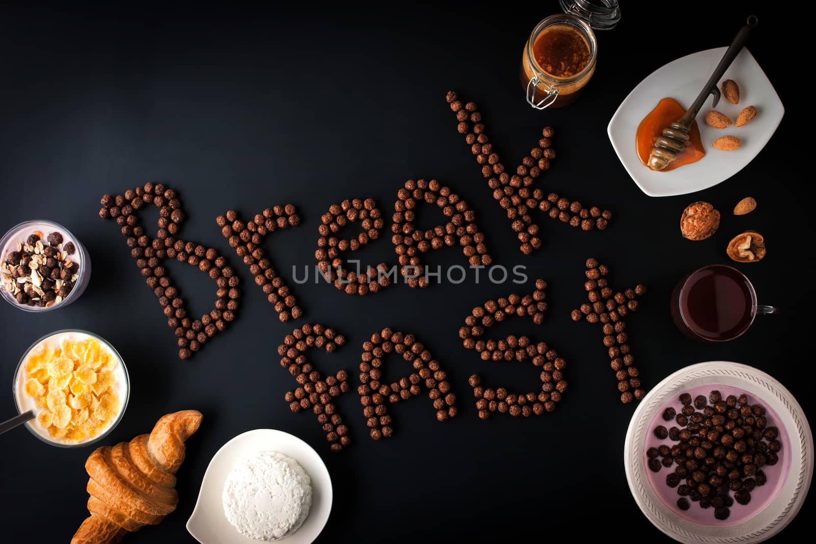 Breakfast word made by chocolate crispy ball with different breakfast attributes