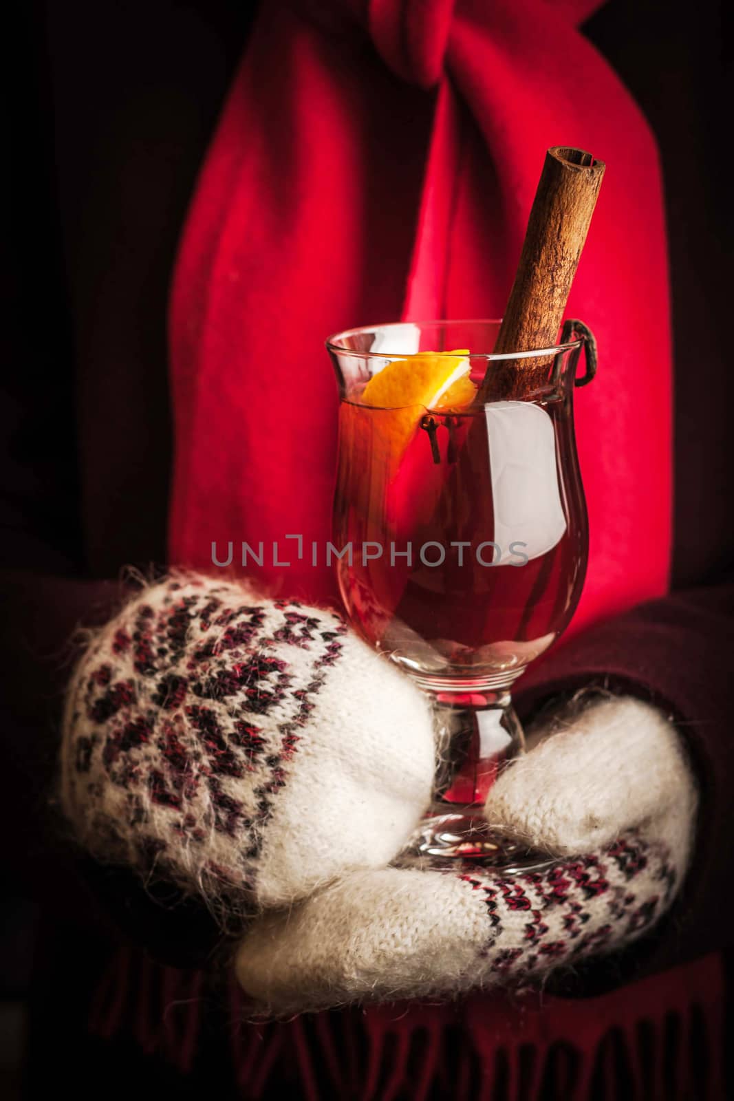 Mulled whine in the hands in knitted mittens by Deniskarpenkov