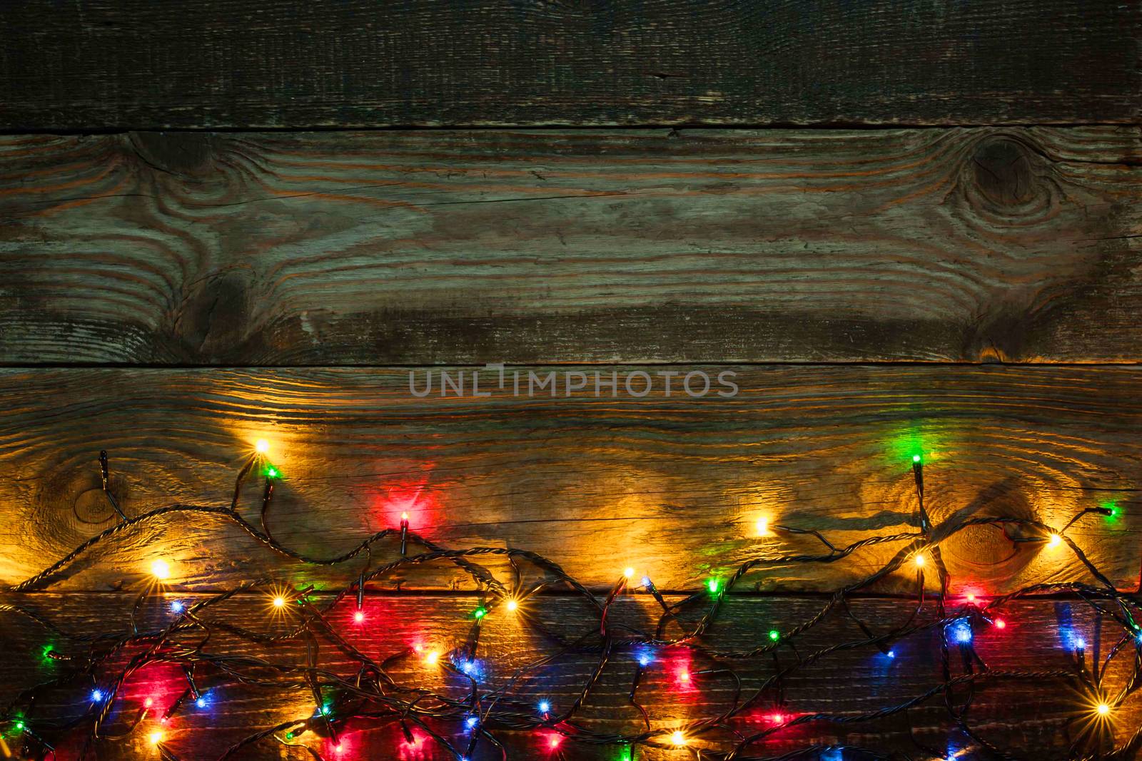 Colorful festoon on the wooden board