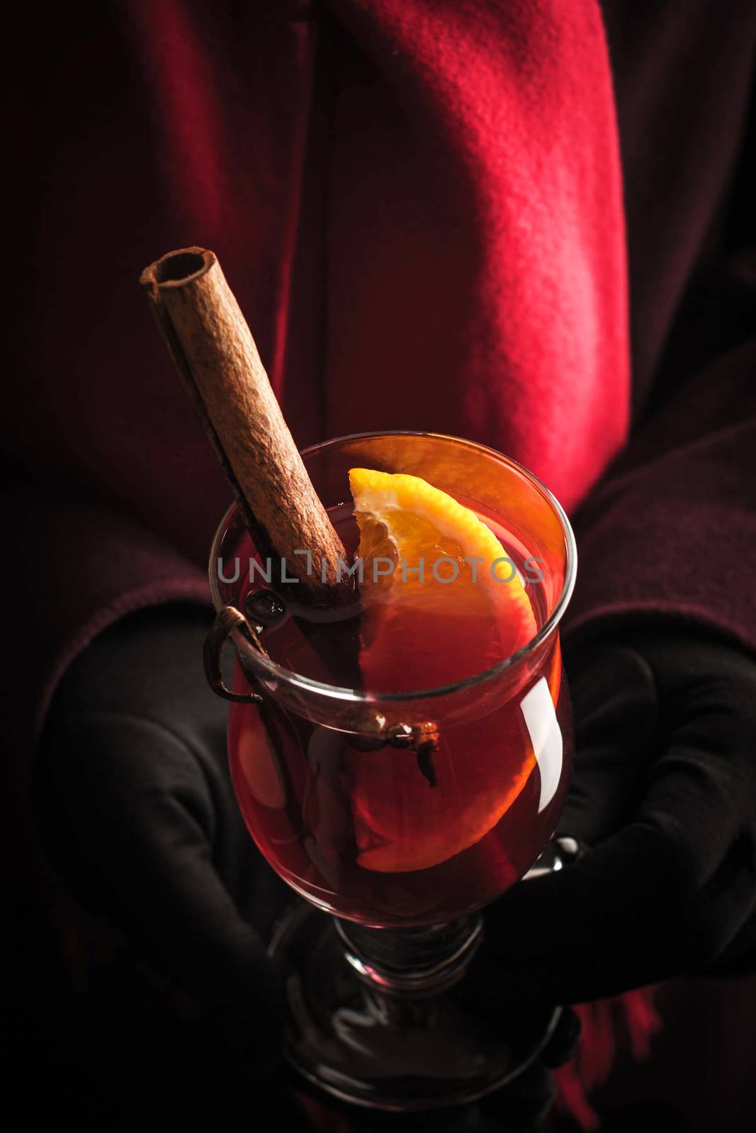 Hand in the gloves with mulled wine by Deniskarpenkov