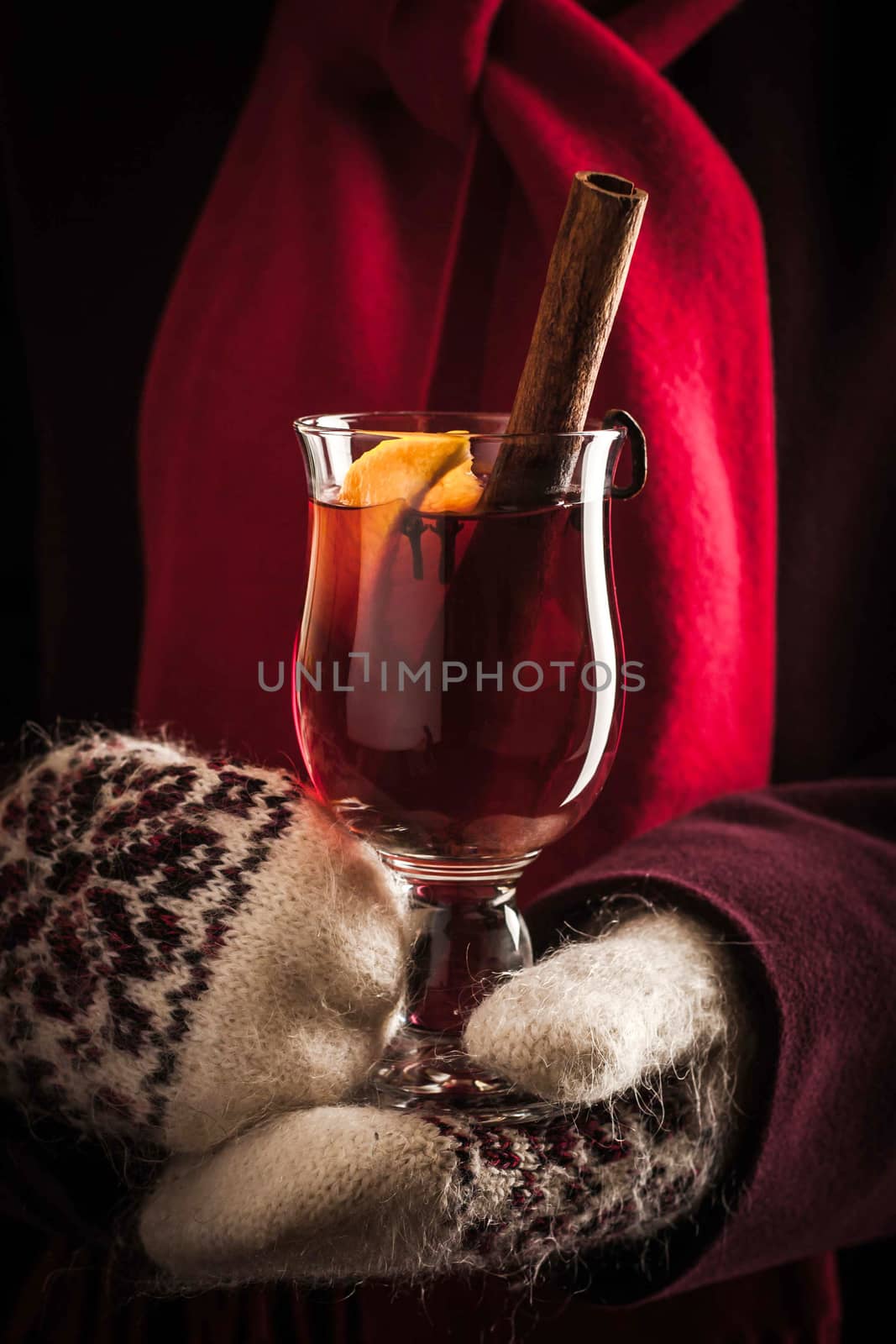 Mulled whine with spices in the hands by Deniskarpenkov