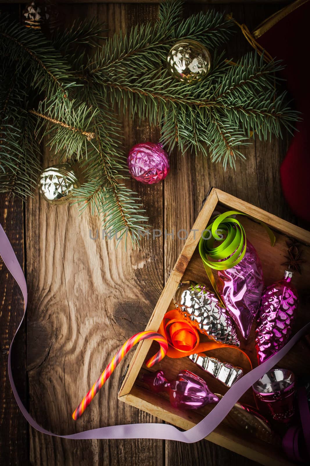 Wooden box with Christmas tree decoration and candy top view