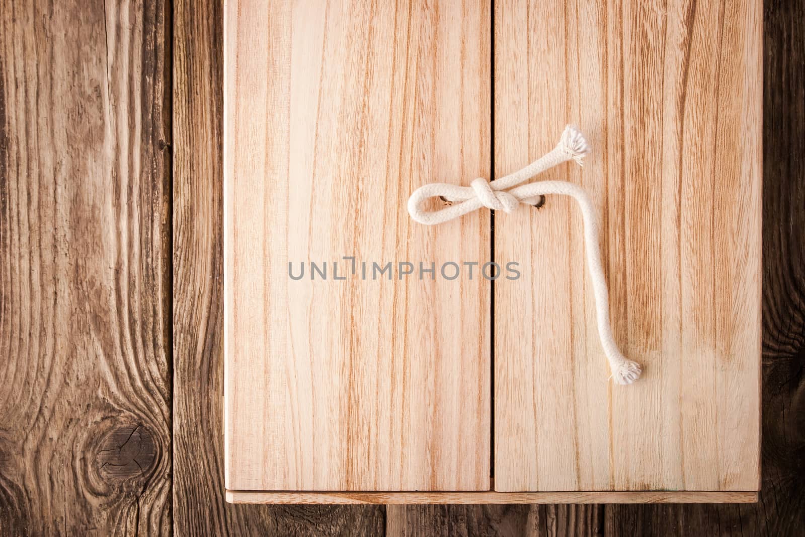 Wooden shelf with doors on the wooden background horizontal