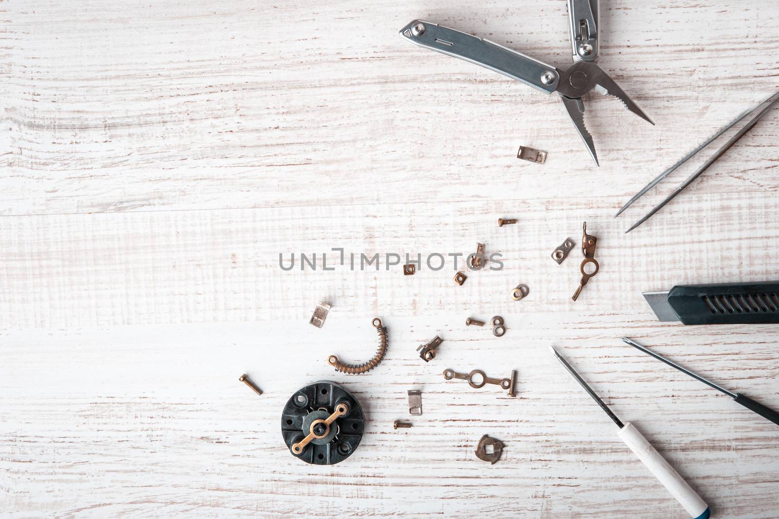 Tools and disassembled mechanism on the desktop horizontal