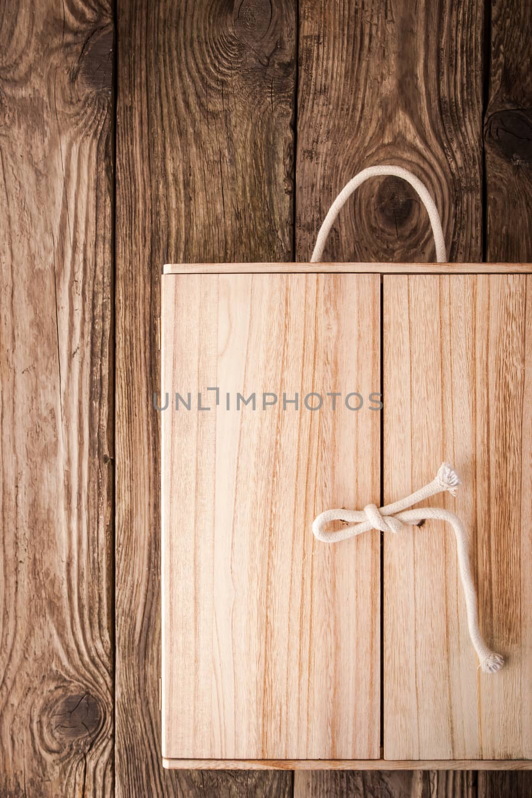 Wooden shelf with doors on the wooden background vertical