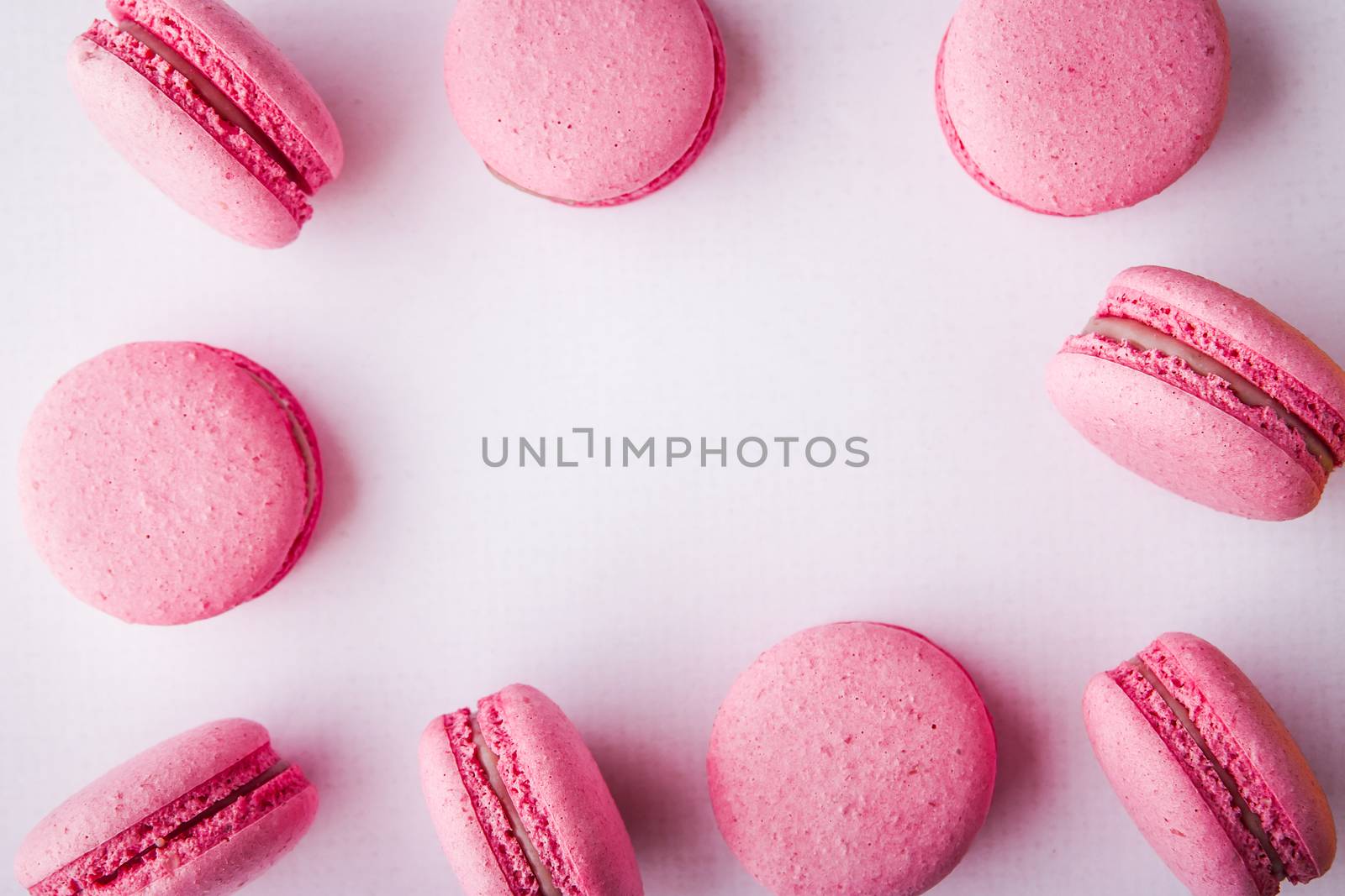 Pink macaroon on a white tablecloth horizontal