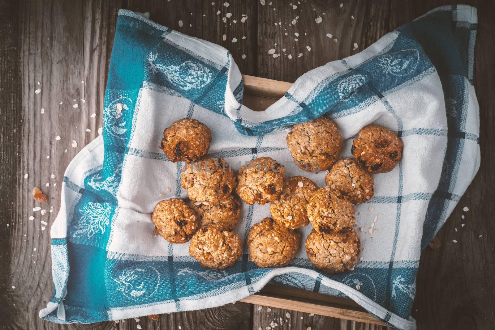 Oatmeal cookies on a towel on the wooden table horizontal