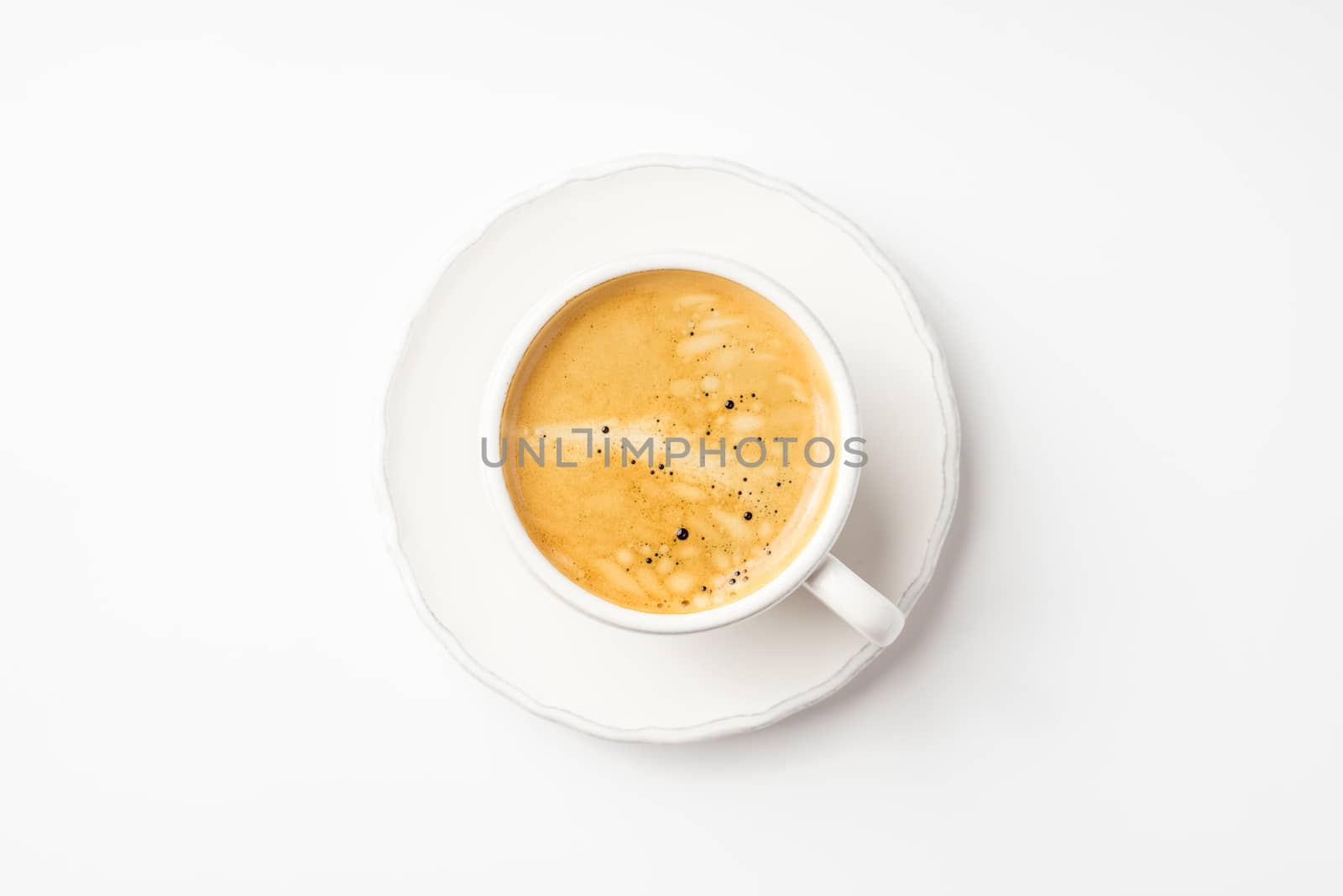 Coffee in ceramic cup on a white table horizontal