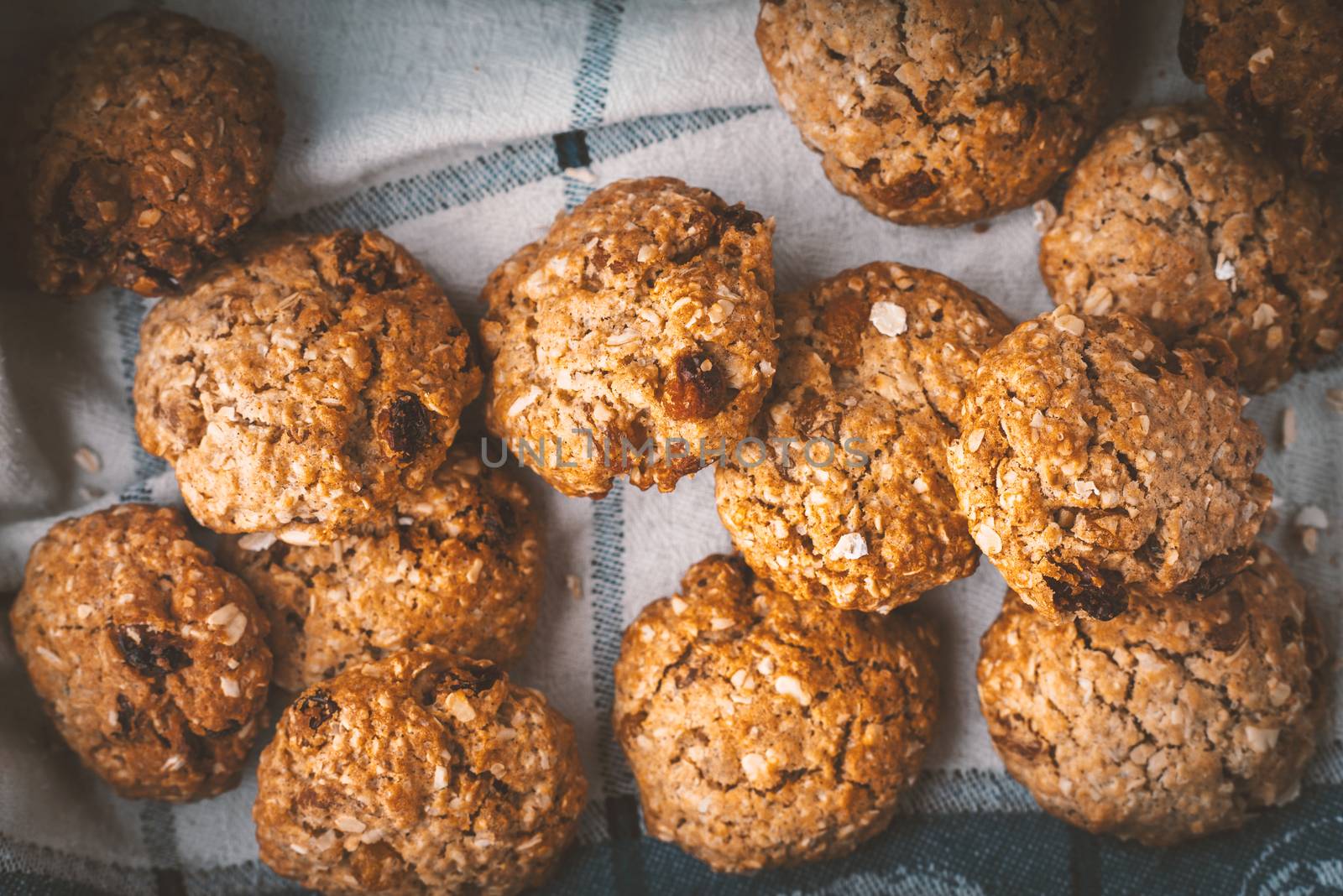 Oatmeal cookies with raisins on a towel horizontal