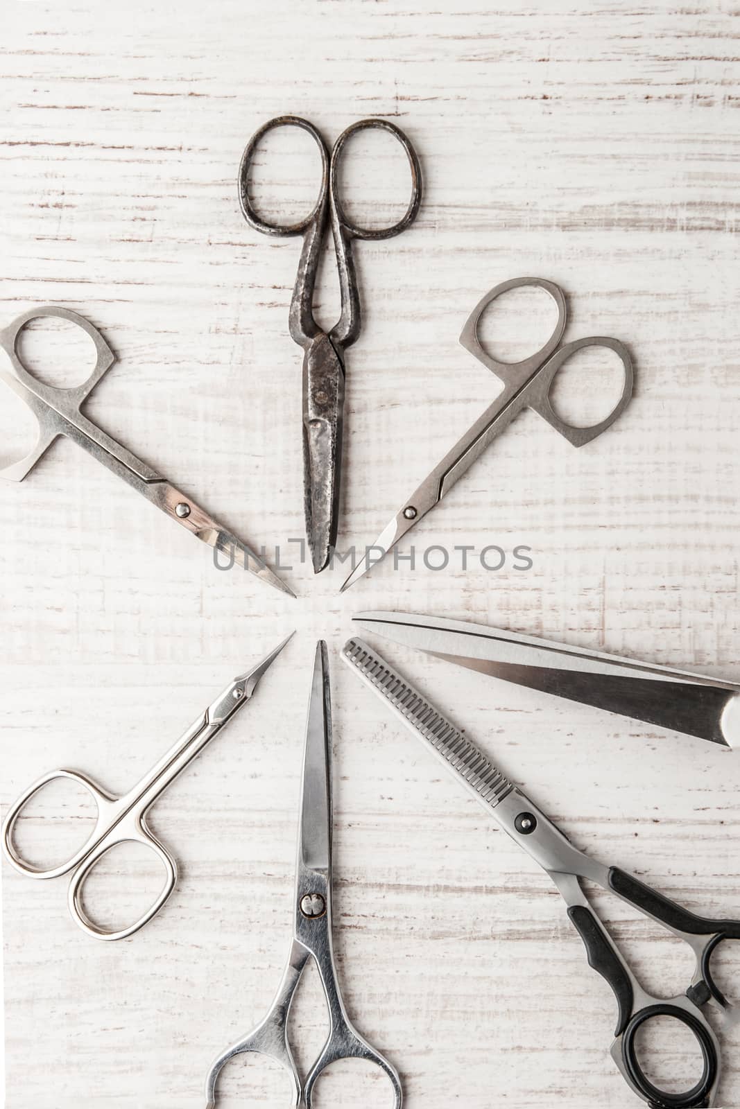 Set of scisSet of scissors on a wooden table horizontalsors 