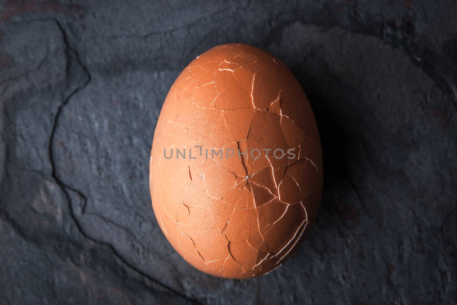 Chicken eggs in the cracks in the stone table horizontal