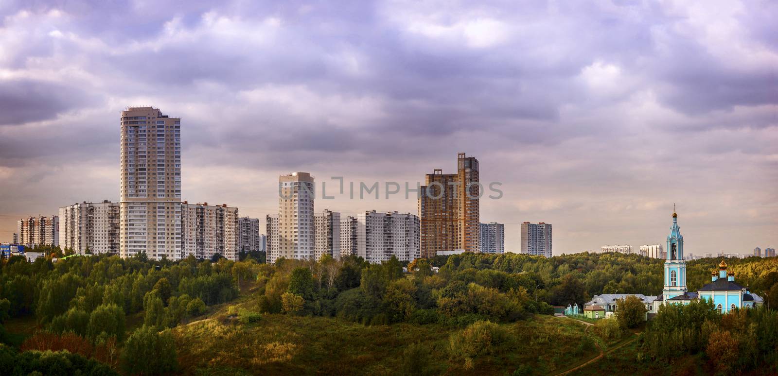 View of the city with blue church and parks panorama