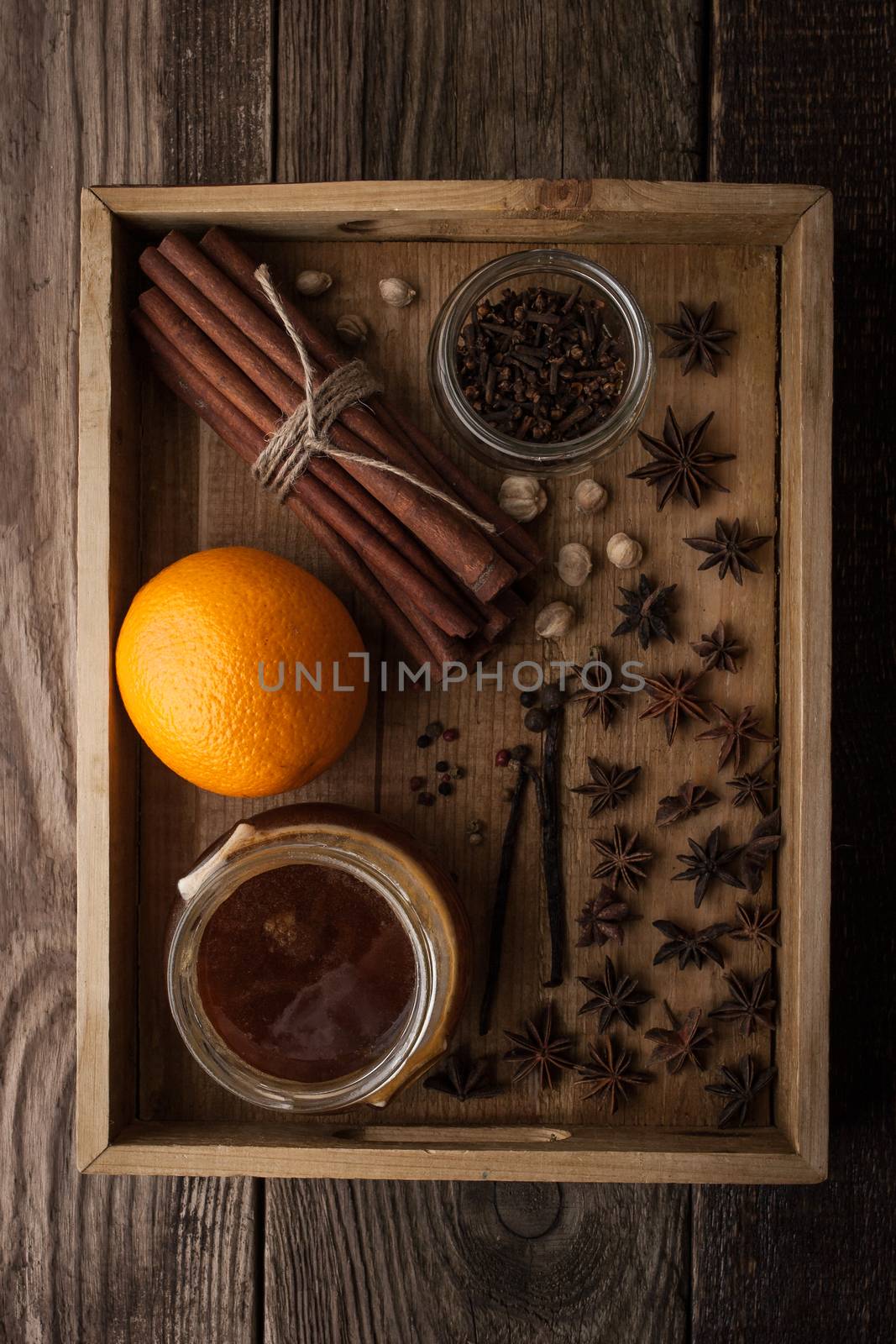 Orange , honey and spices on the wooden tray by Deniskarpenkov