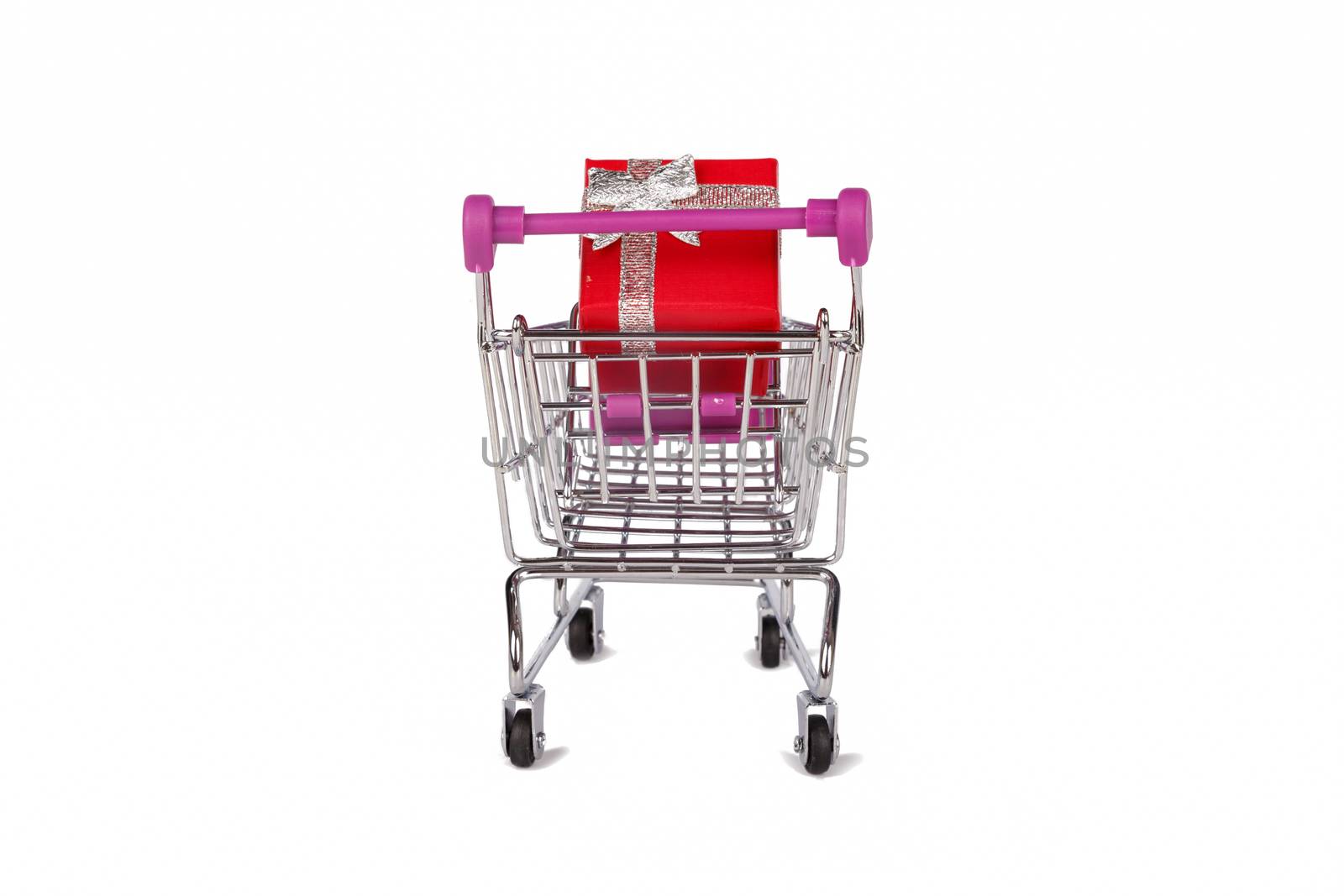 Back view of shopping card or trolley with colorful gift boxes isolated on white background.
